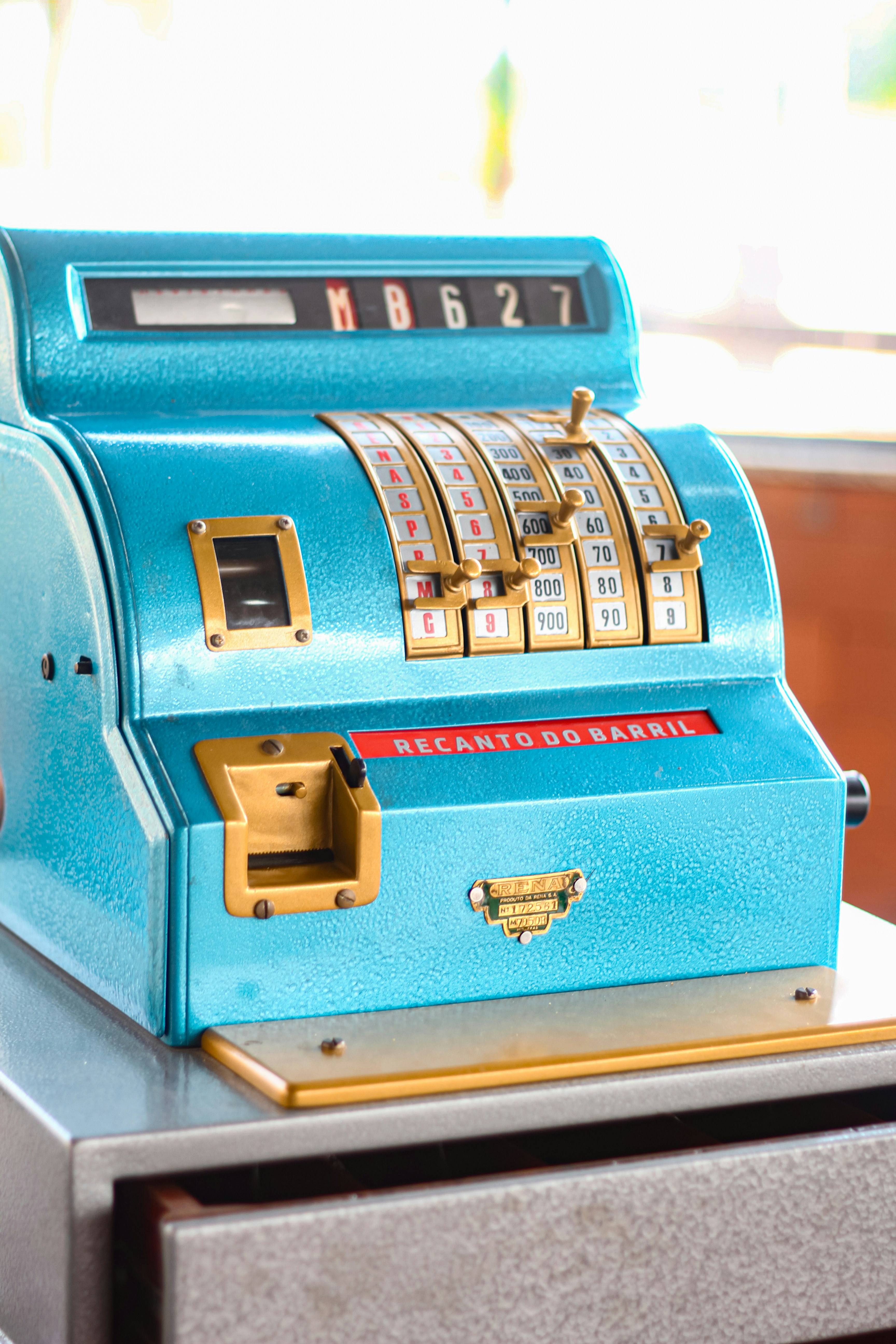 A blue machine sitting on top of a counter