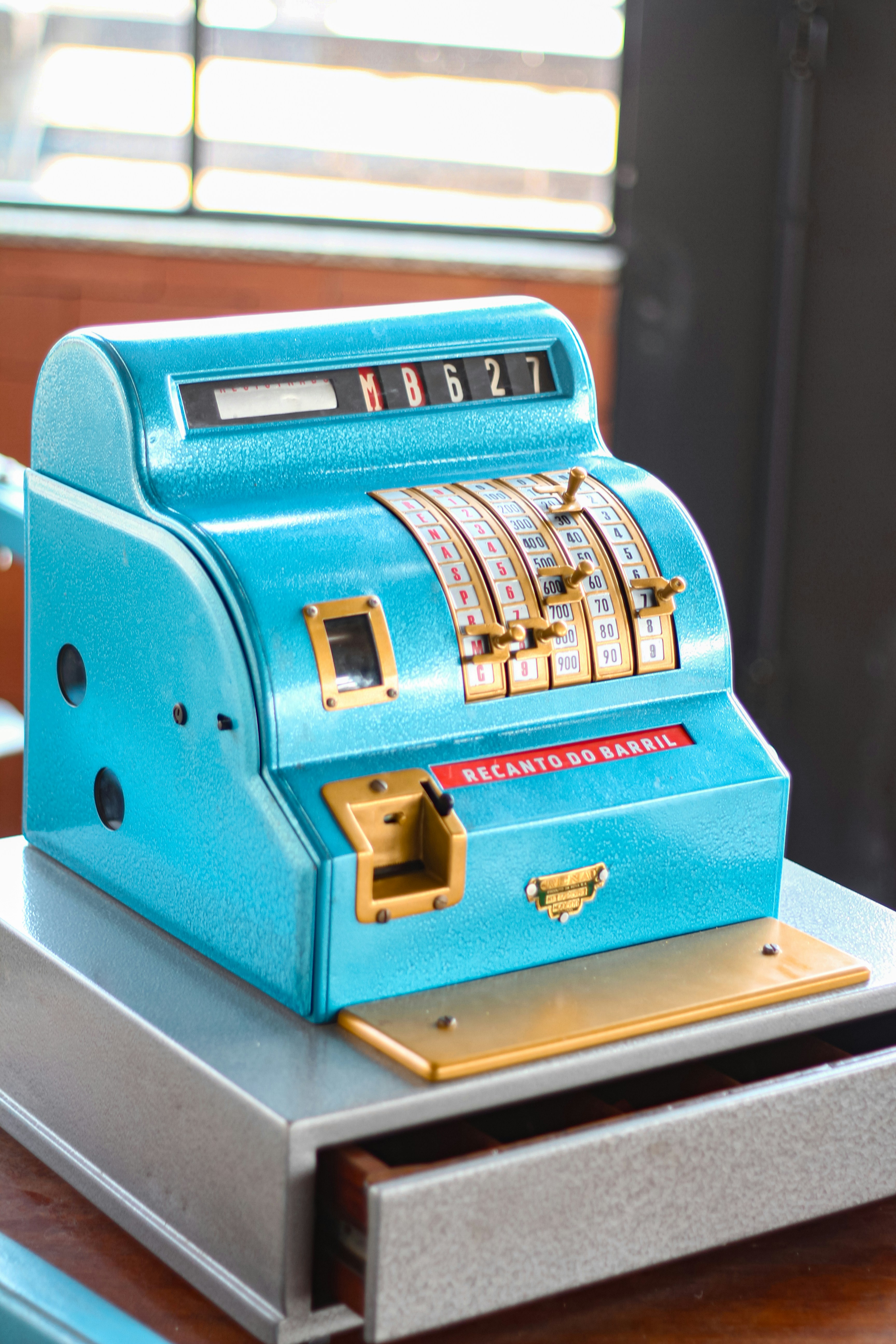 A blue machine sitting on top of a wooden table
