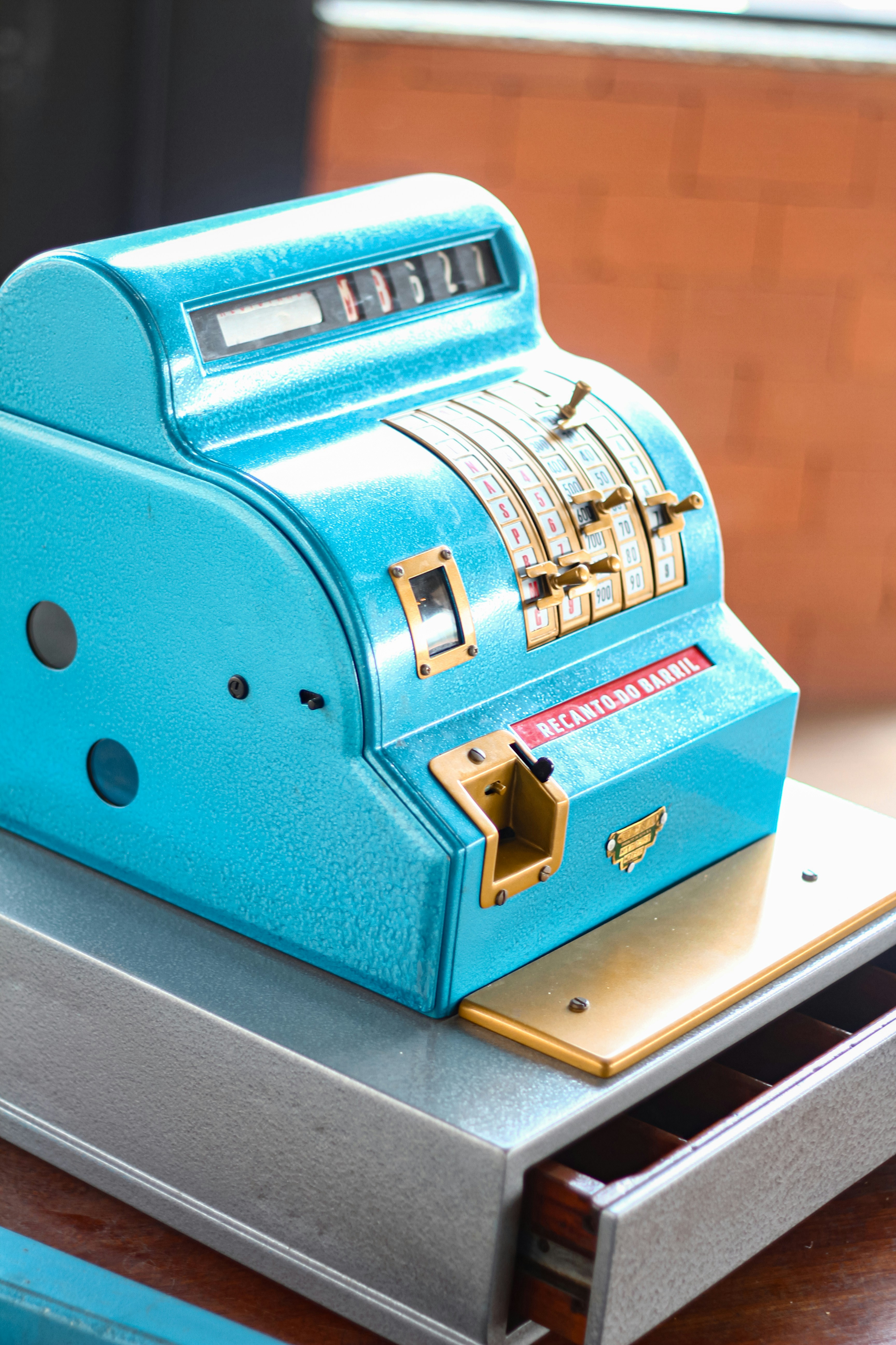 A blue machine sitting on top of a wooden table