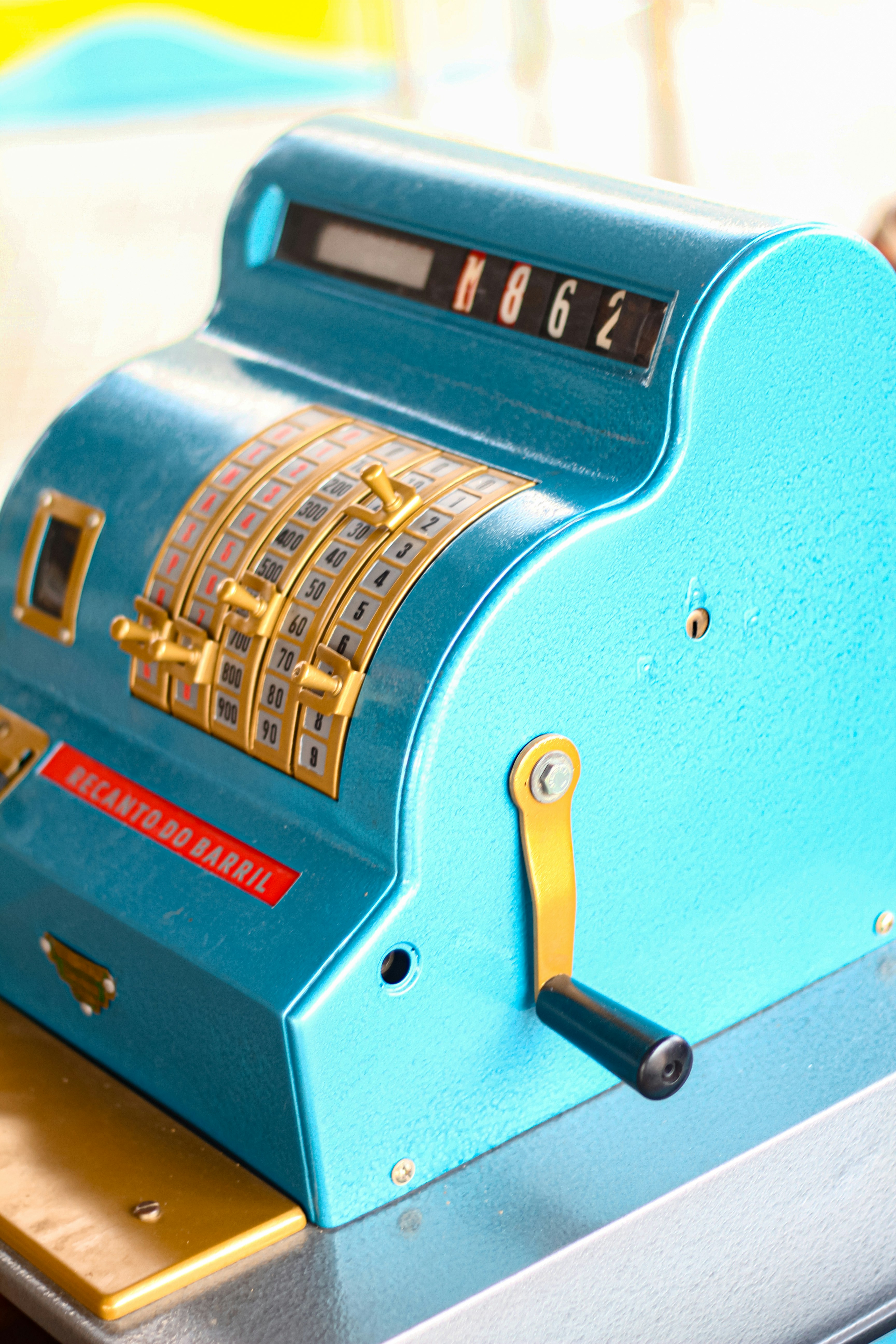 A close up of a blue machine on a table