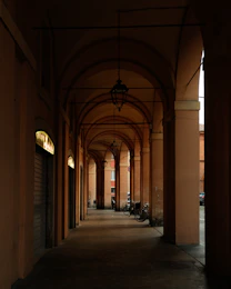 A long hallway with a clock on the wall