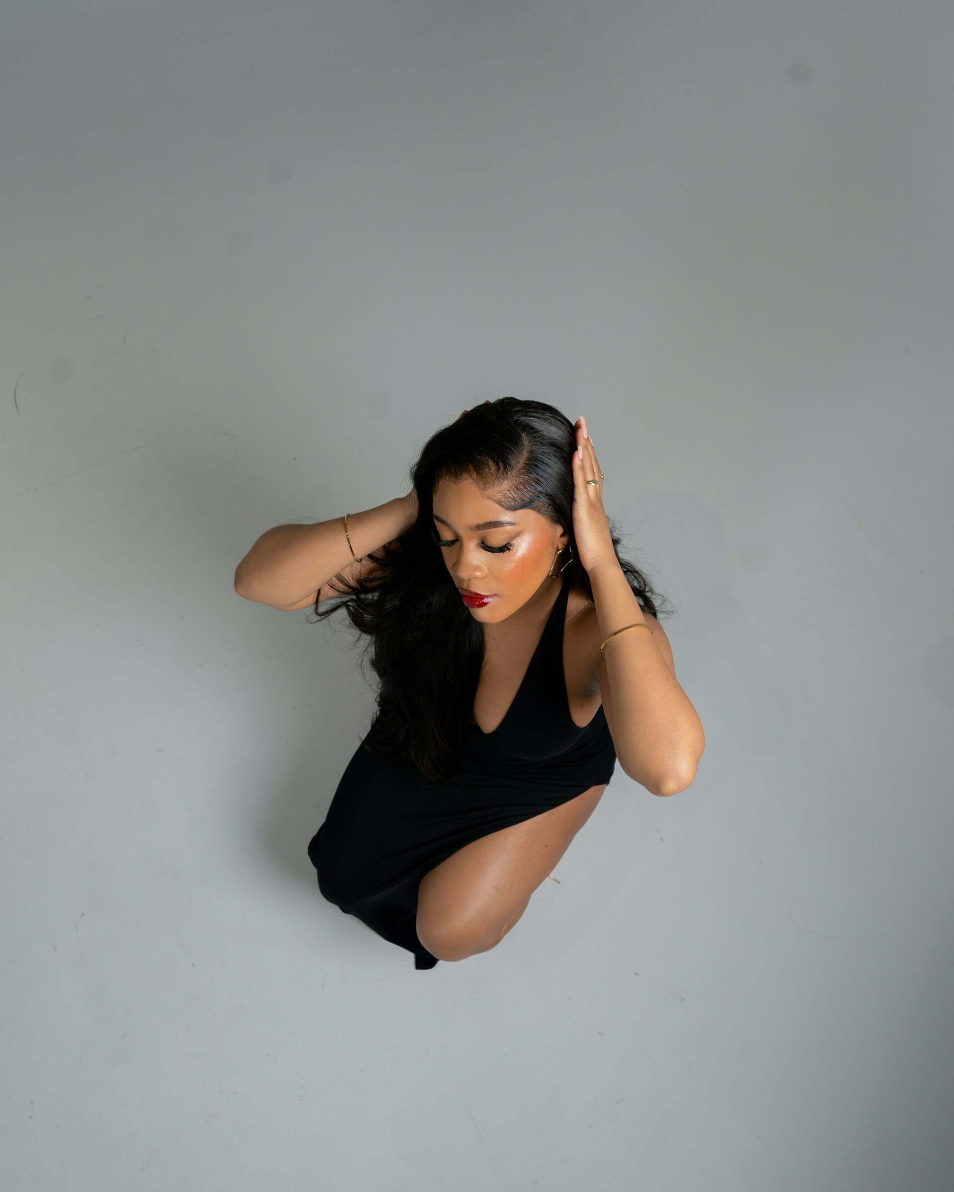 A woman in a black dress posing for a picture