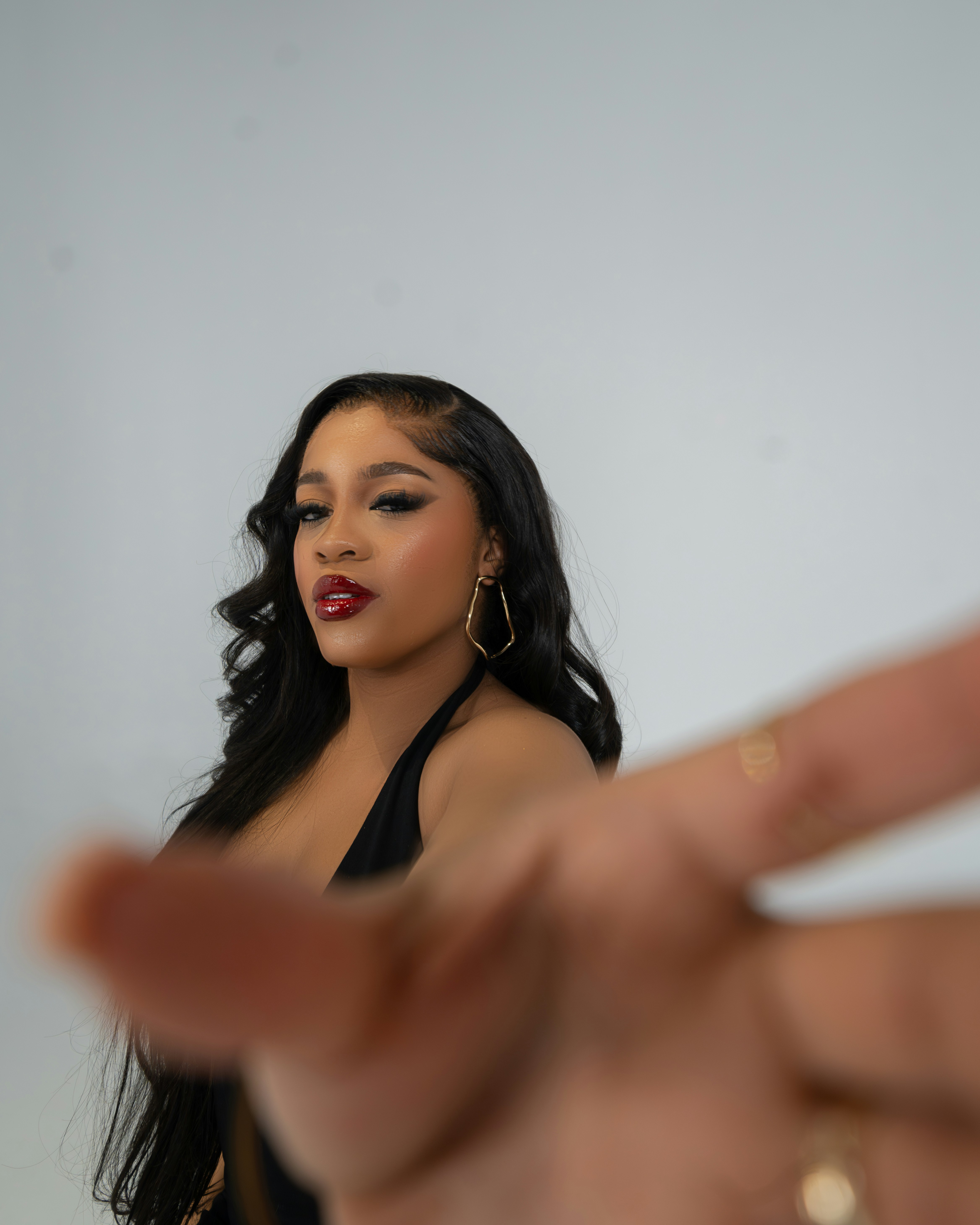 A woman making a hand sign with her fingers