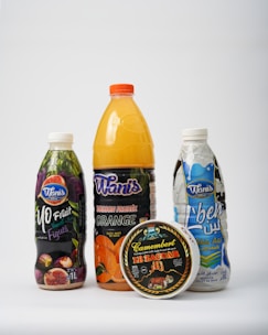 A variety of juices are shown on a white background