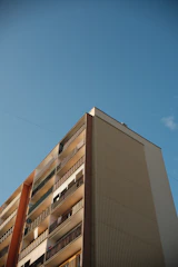 A tall building with balconies and balconies on the balconies