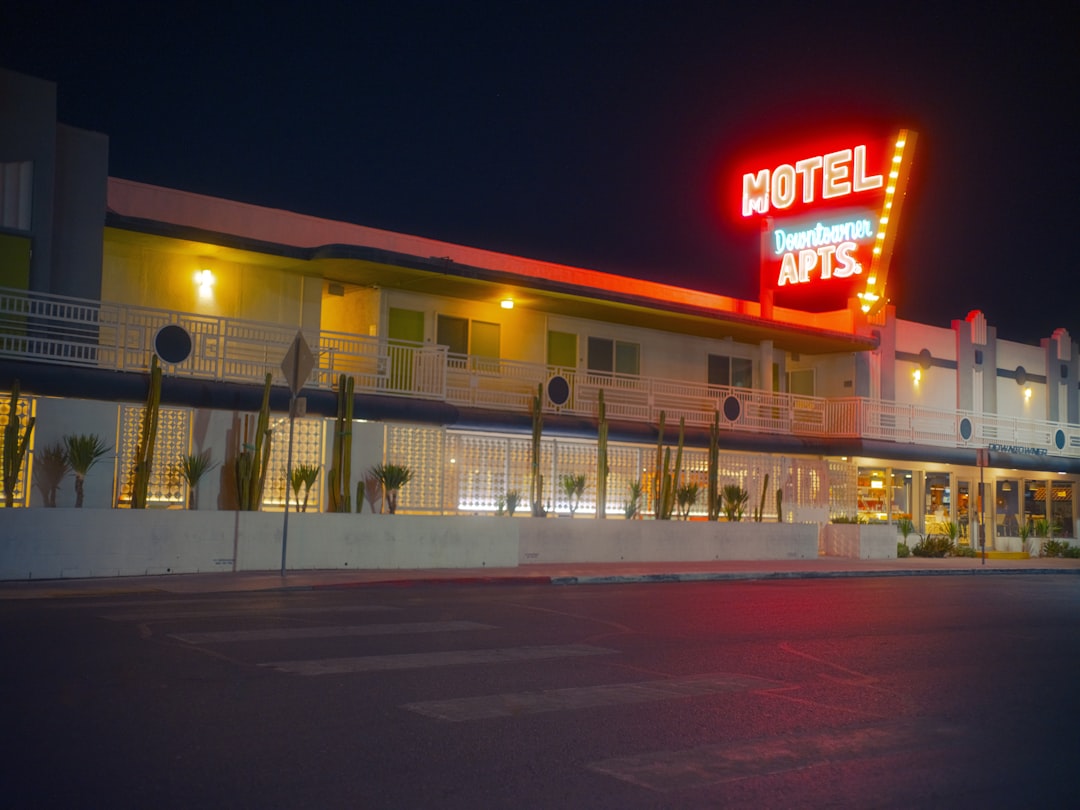 A motel that is lit up at night,