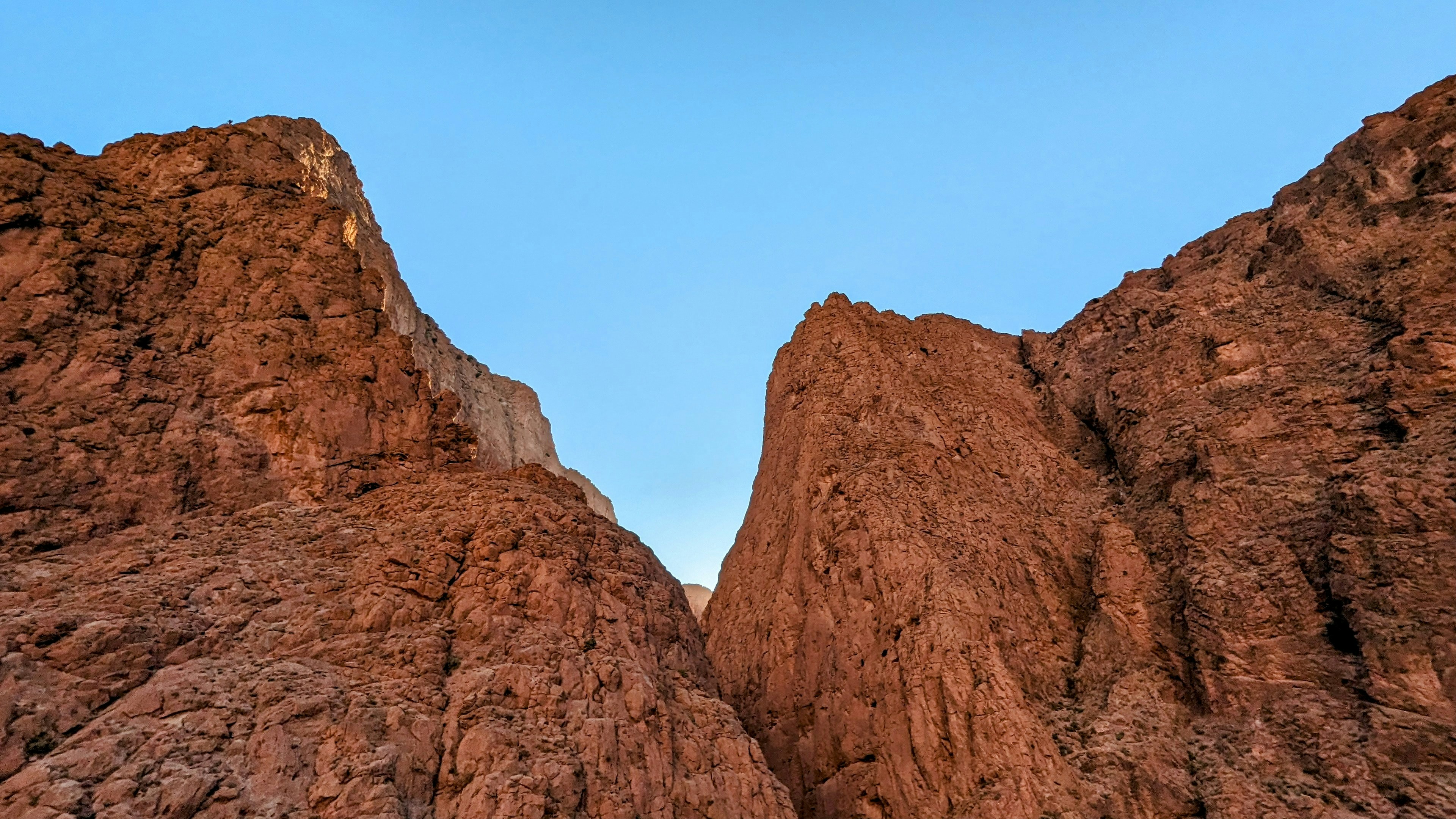 A couple of large rocks sitting next to each other