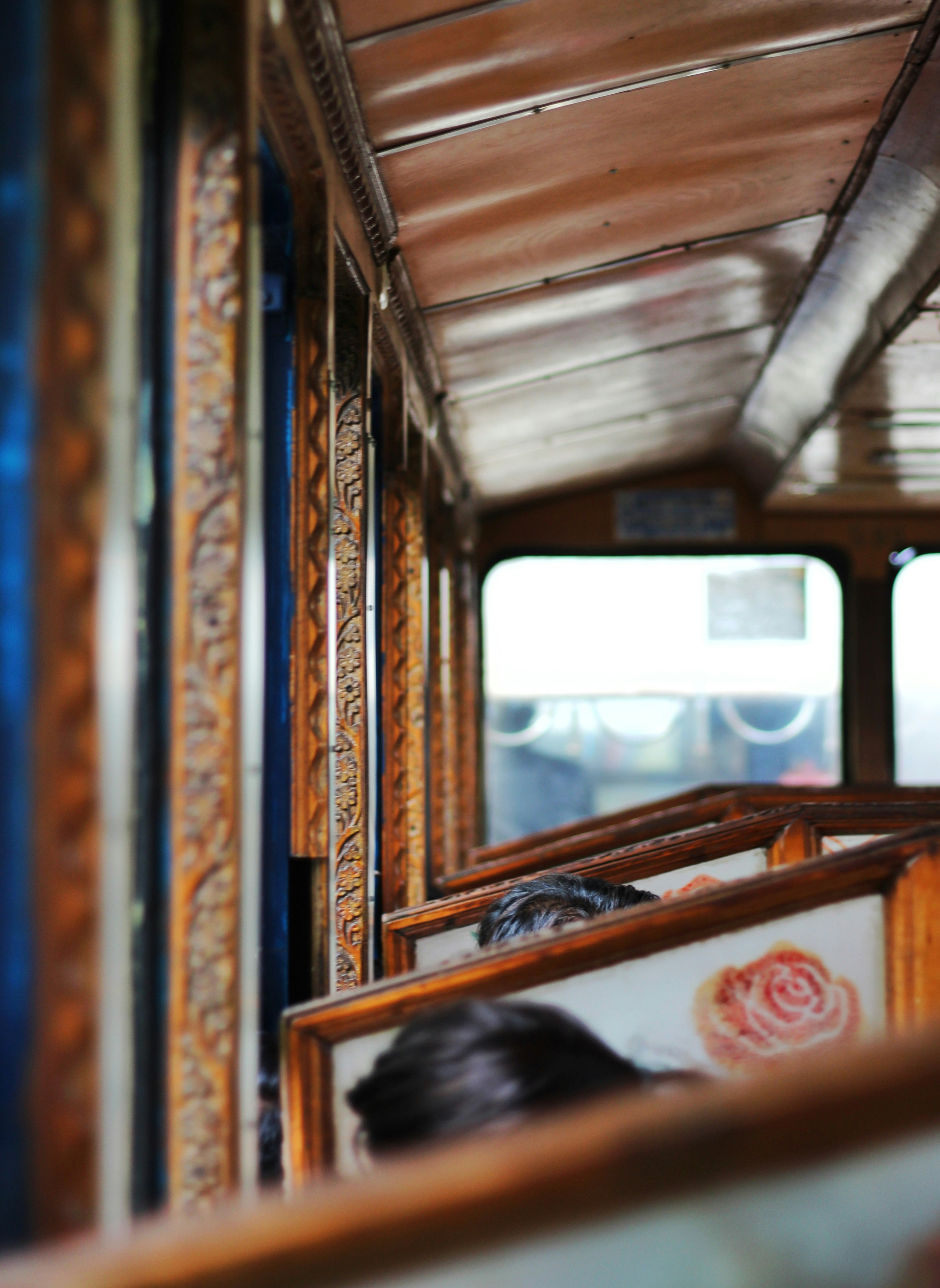 A view of the inside of a bus looking out the window