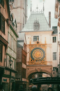 A group of people walking down a street next to tall buildings