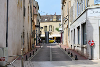 A narrow street with buildings on both sides
