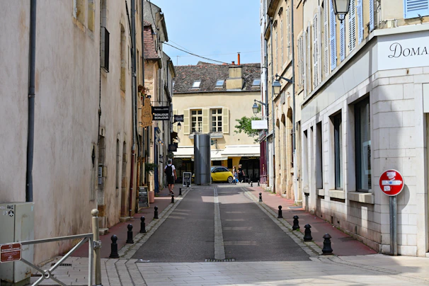 A narrow street with buildings on both sides