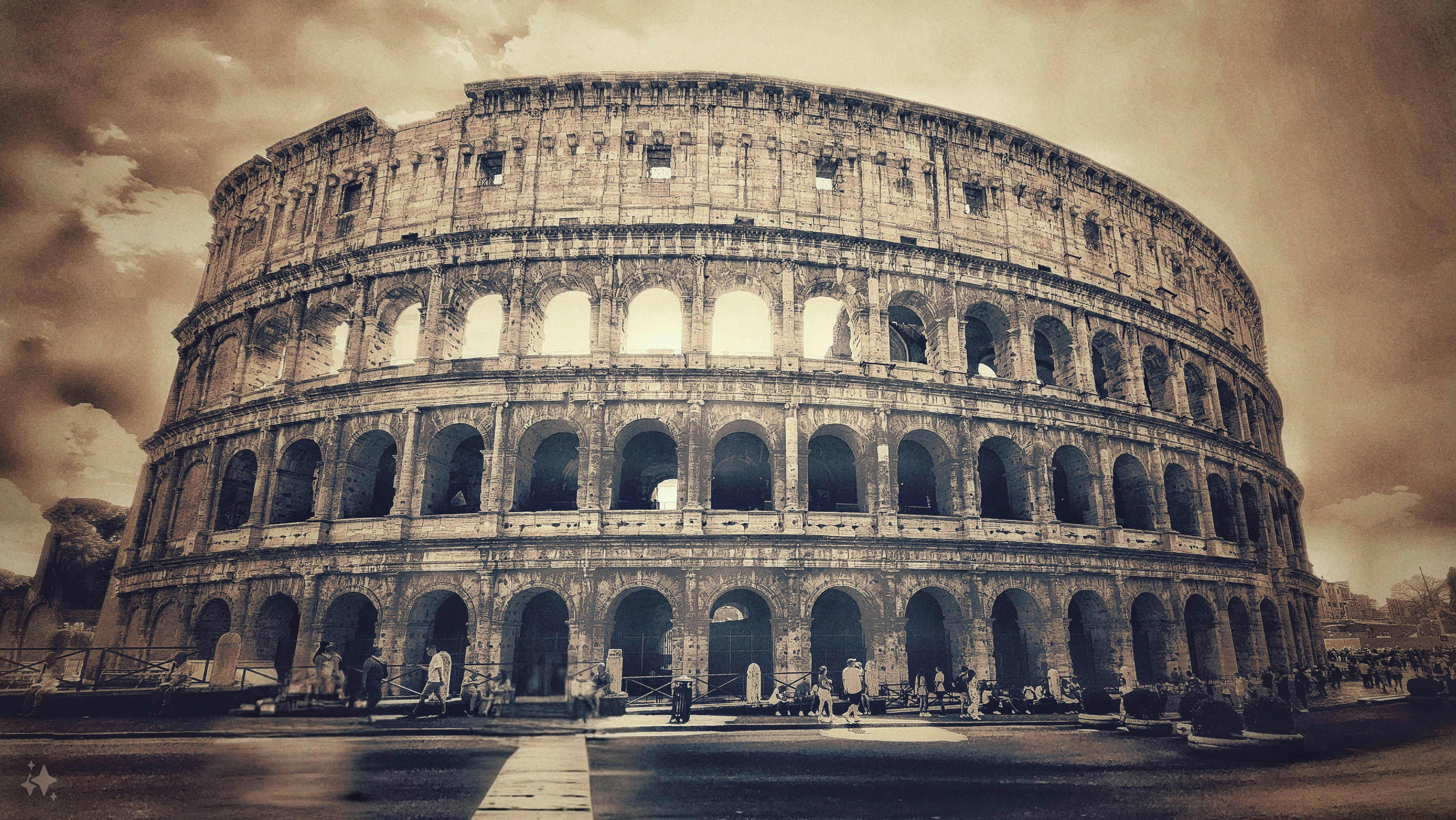 An old photo of the colossion in rome, This captivating image presents the Colosseum in Rome, captured in a sepia tone that evokes a vintage, timeless feel. The grand structure, with its iconic arches and weathered stone, stands as a testament to the enduring legacy of the Roman Empire. The aged effect highlights the historical significance and ancient majesty of the Colosseum, while the scattered crowds at the base offer a sense of scale and liveliness, connecting the past with the present. The dramatic sky and muted tones contribute to the overall nostalgic atmosphere, making the image feel like a journey back in time.