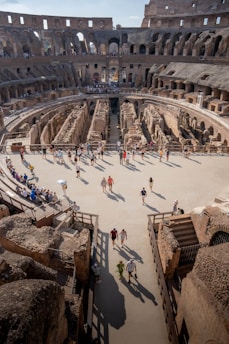A group of people walking around inside of a building