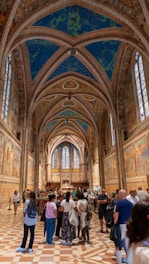 A group of people standing in a large building