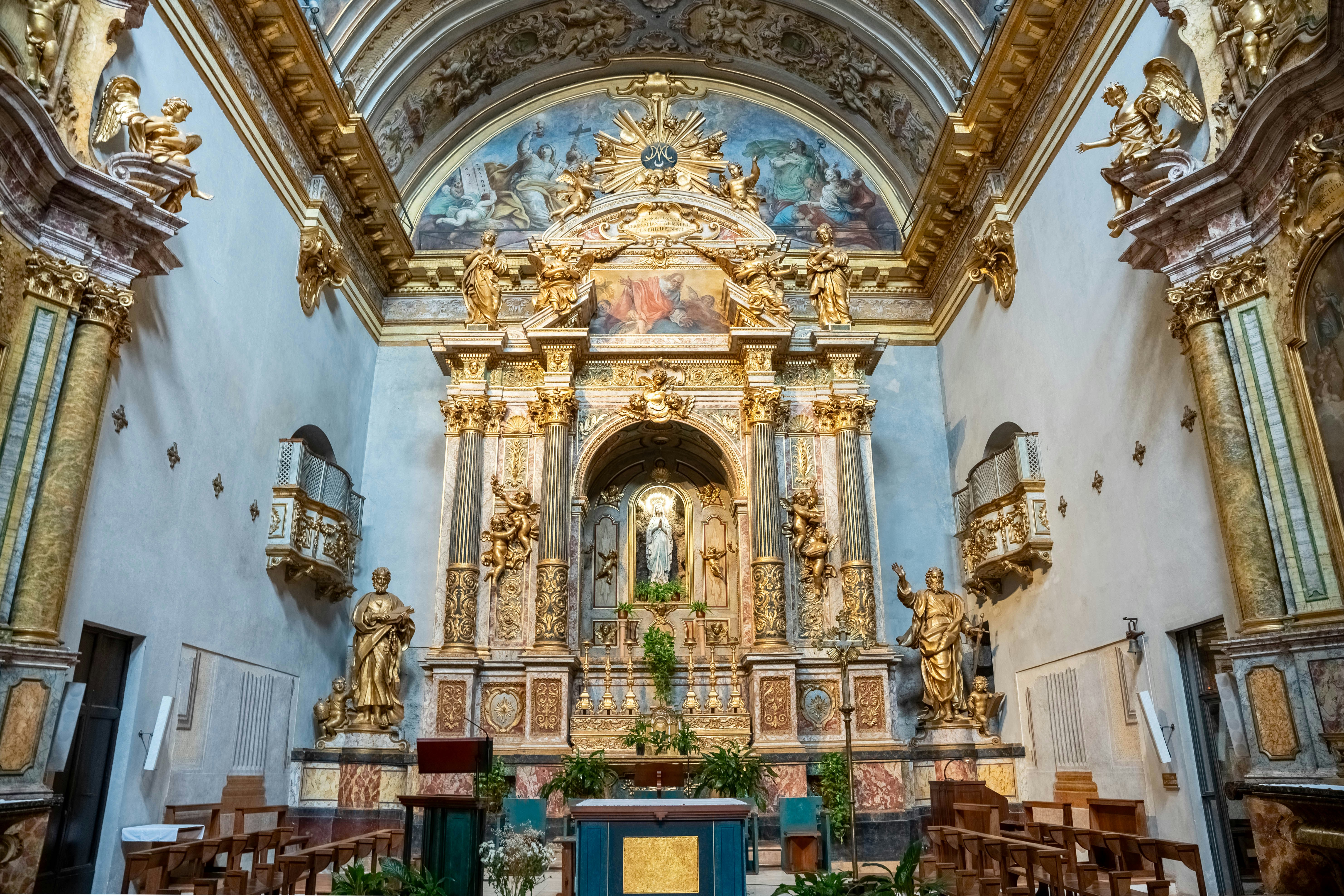 The interior of a church with gold and blue decor