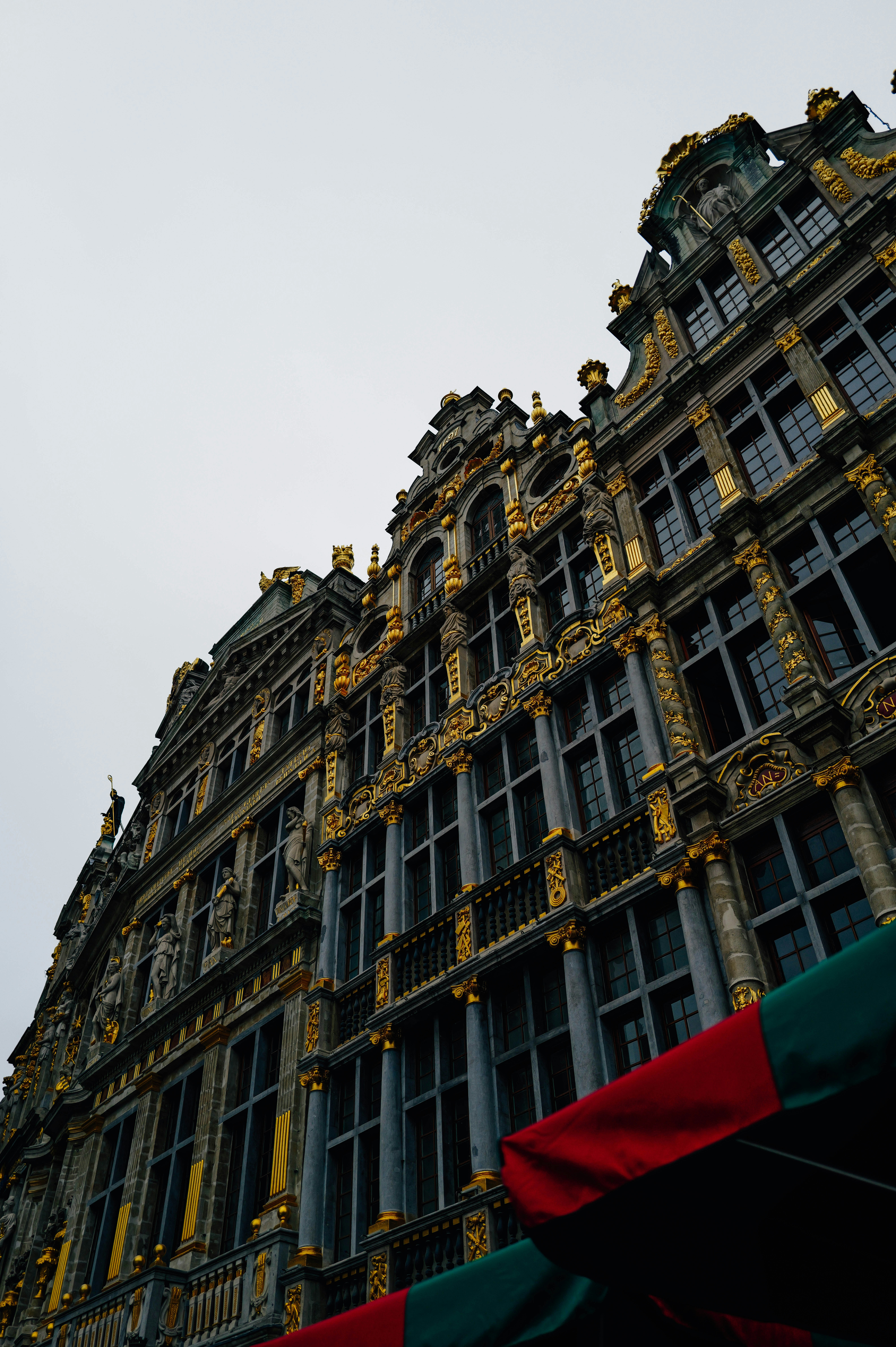 A very tall building with a clock on it's side photo – Free Building ...