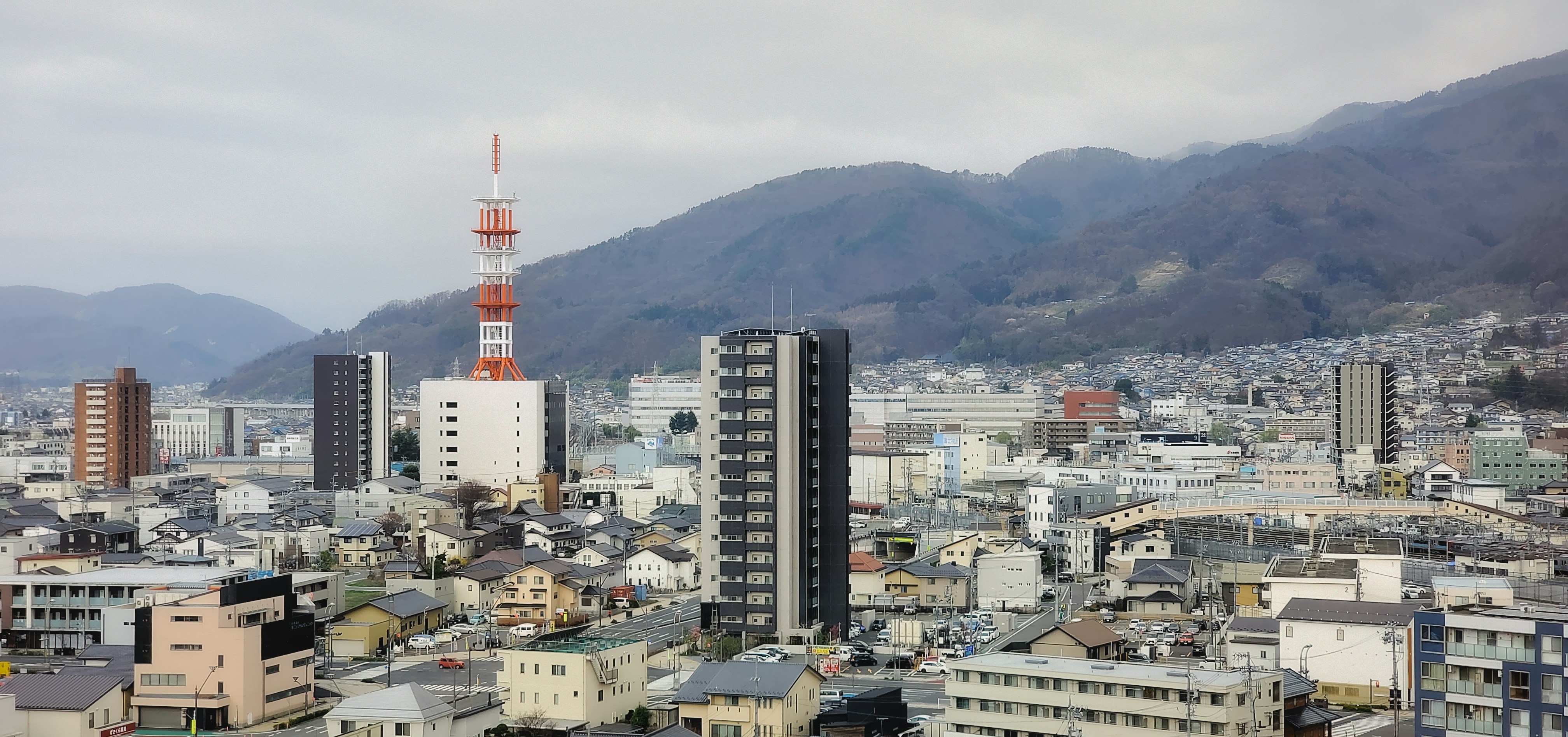 A view of a city with mountains in the background