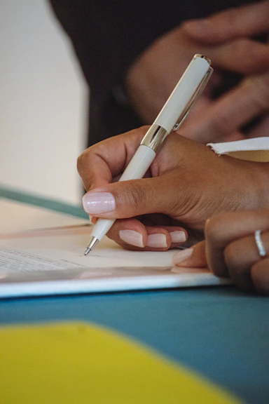 Woman completing a guided career-proof worksheet during a professional development seminar.
