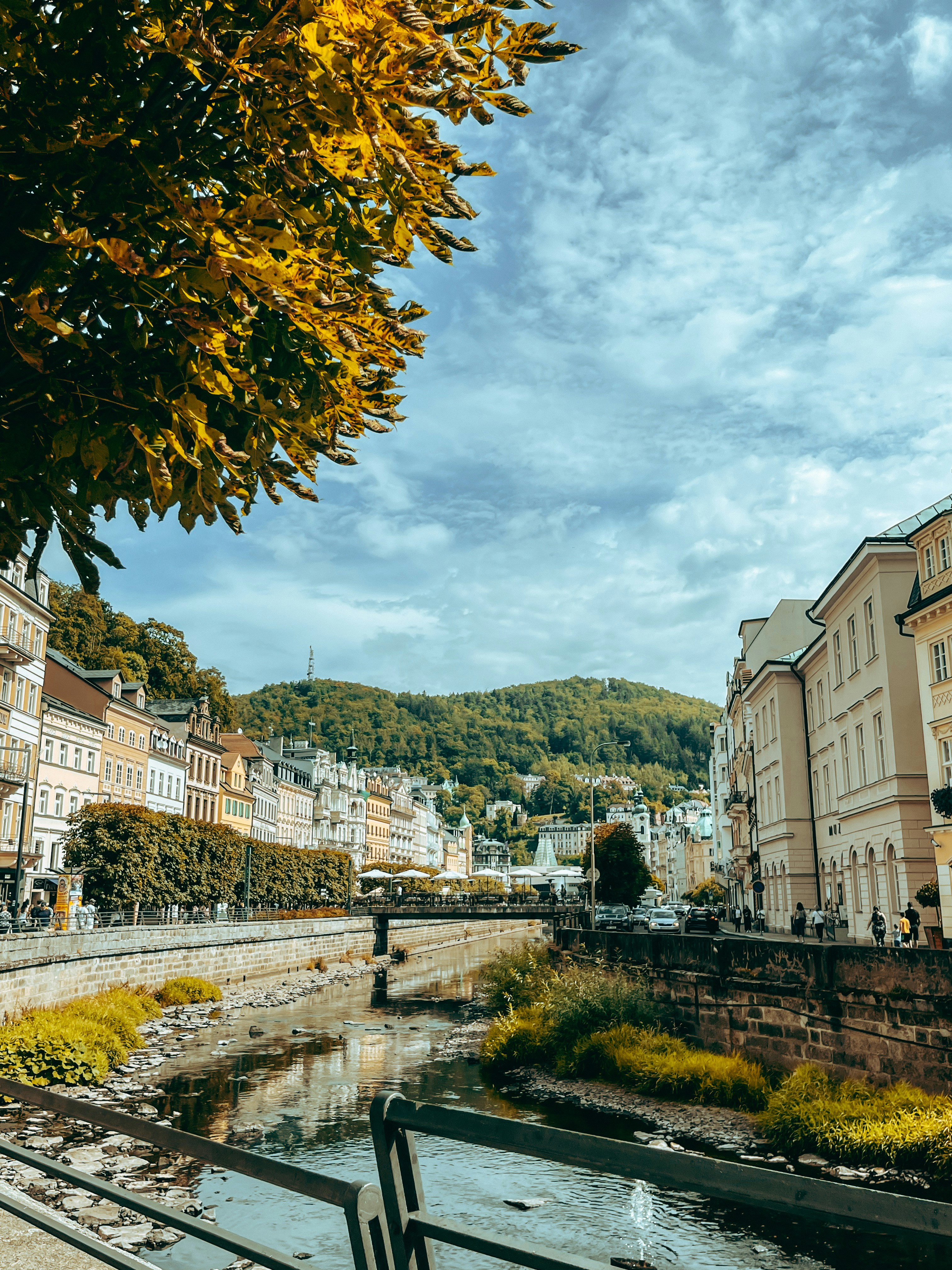 A river running through a city next to tall buildings