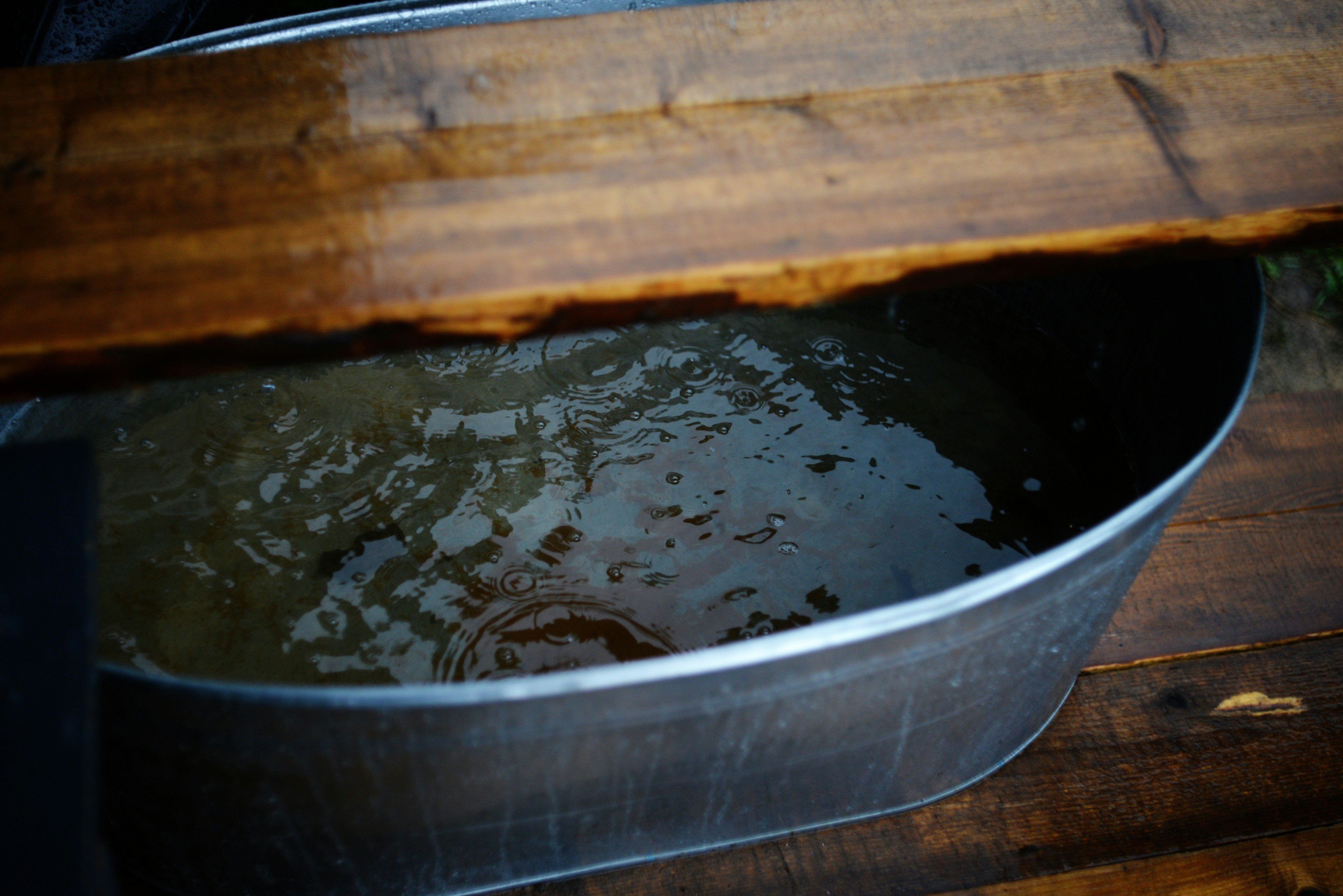 water pooling in a metal emergency drain pan with a safety float switch