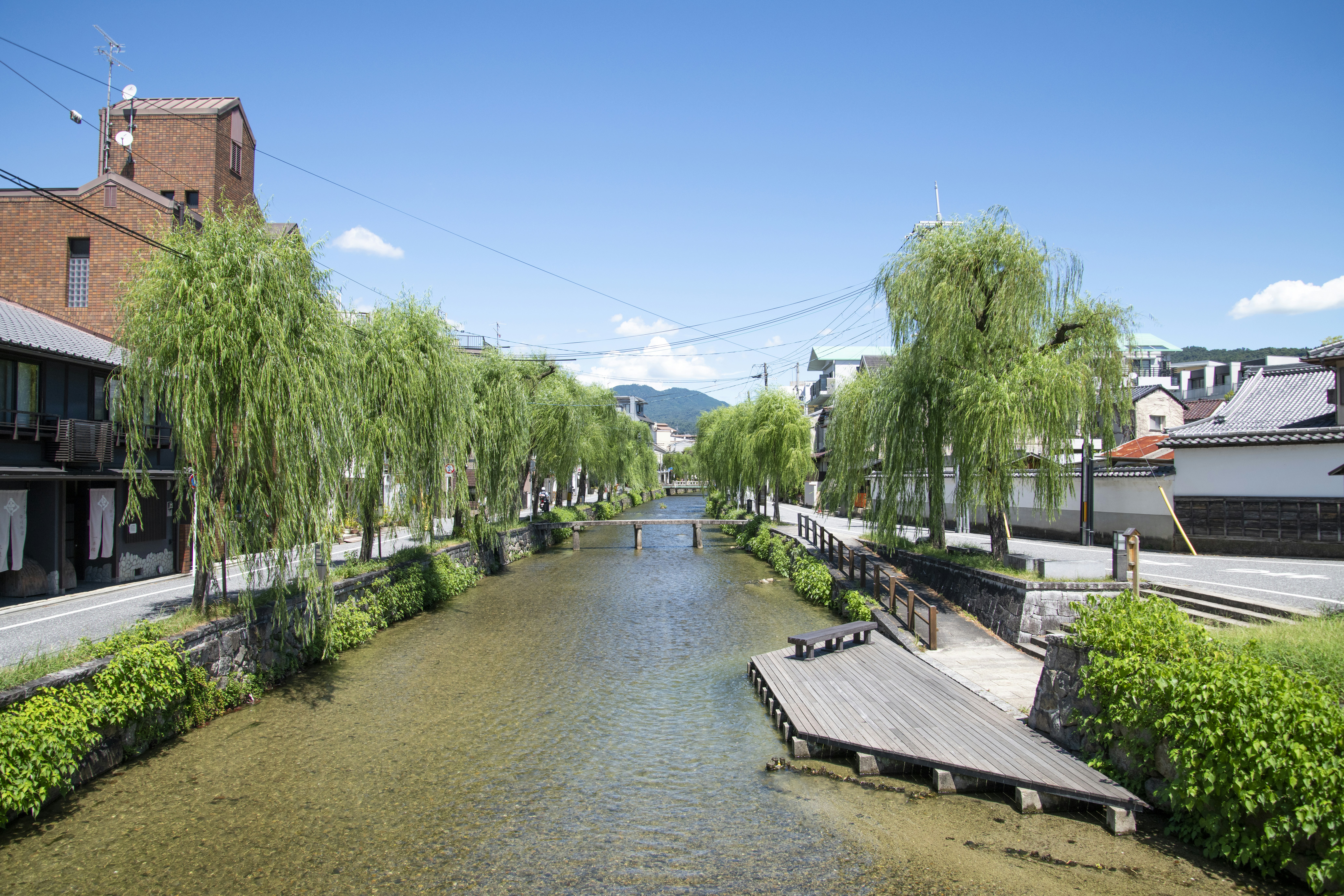 A river running through a lush green countryside