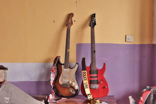 A group of guitars hanging on a wall