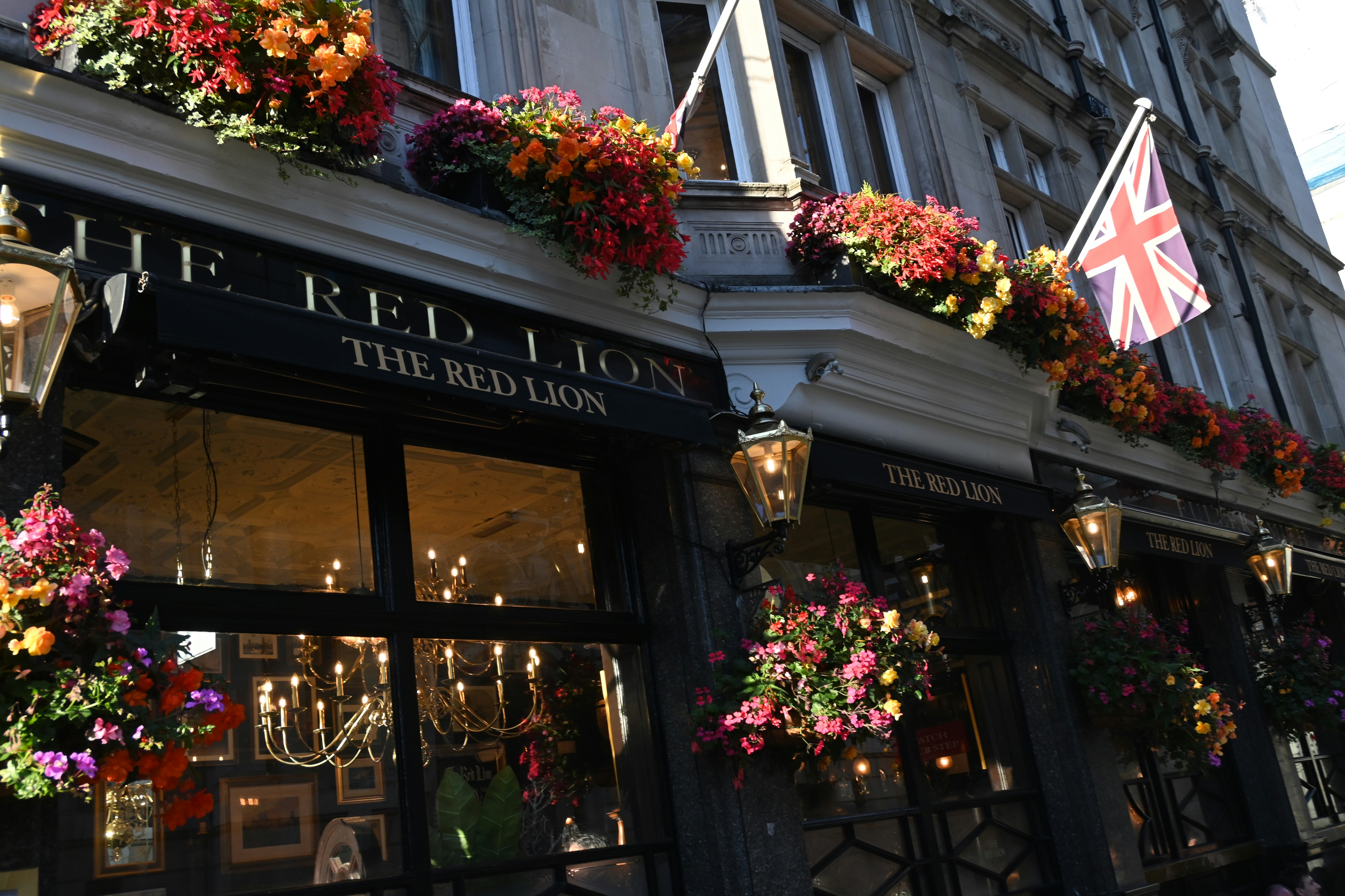A building with flowers on the outside of it