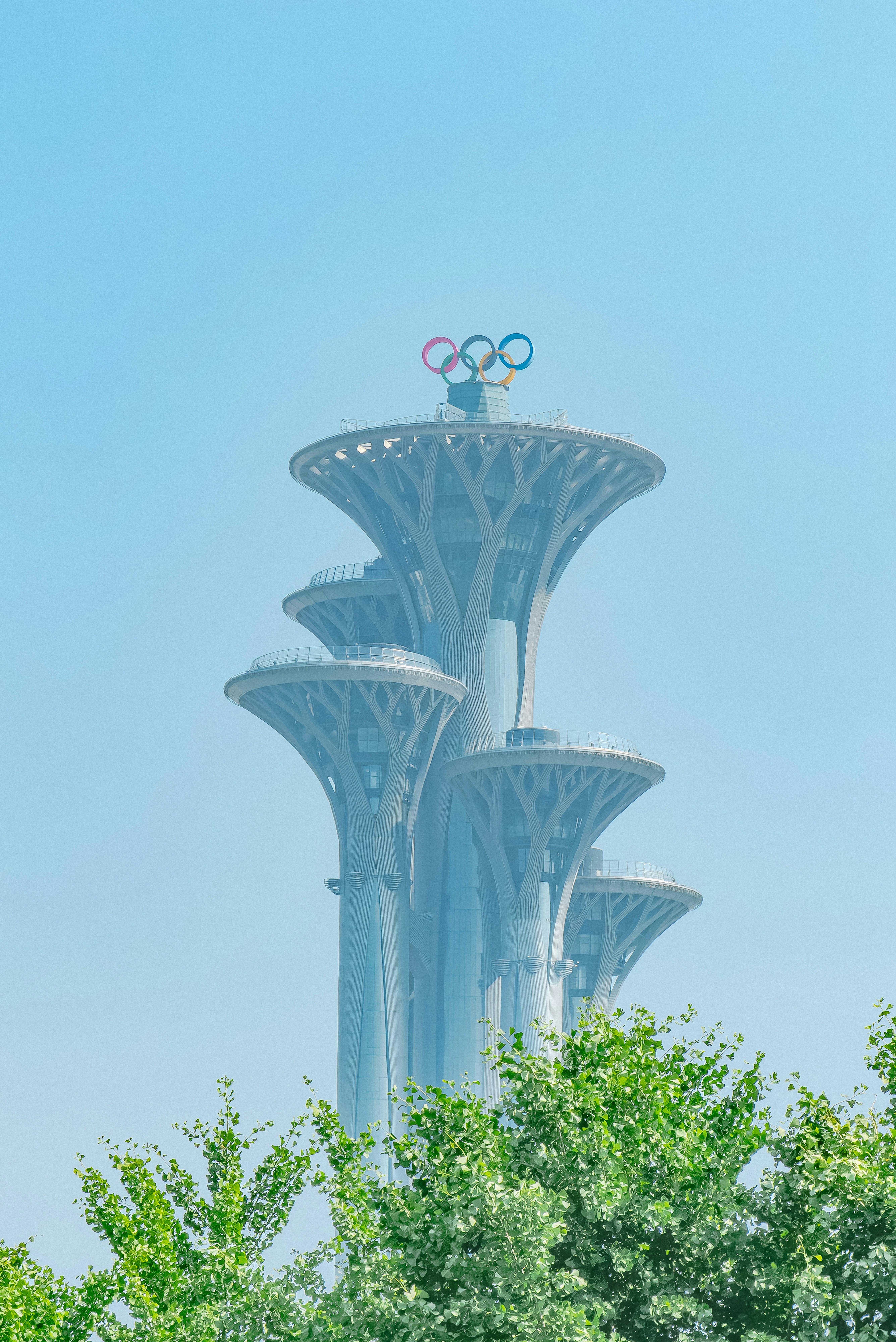 The olympic rings are on top of the building