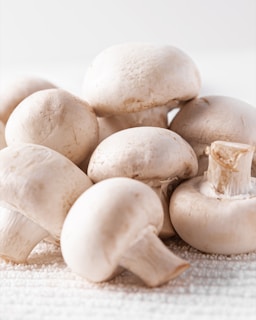 A pile of mushrooms sitting on top of a table