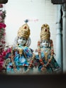 A couple of statues sitting next to each other