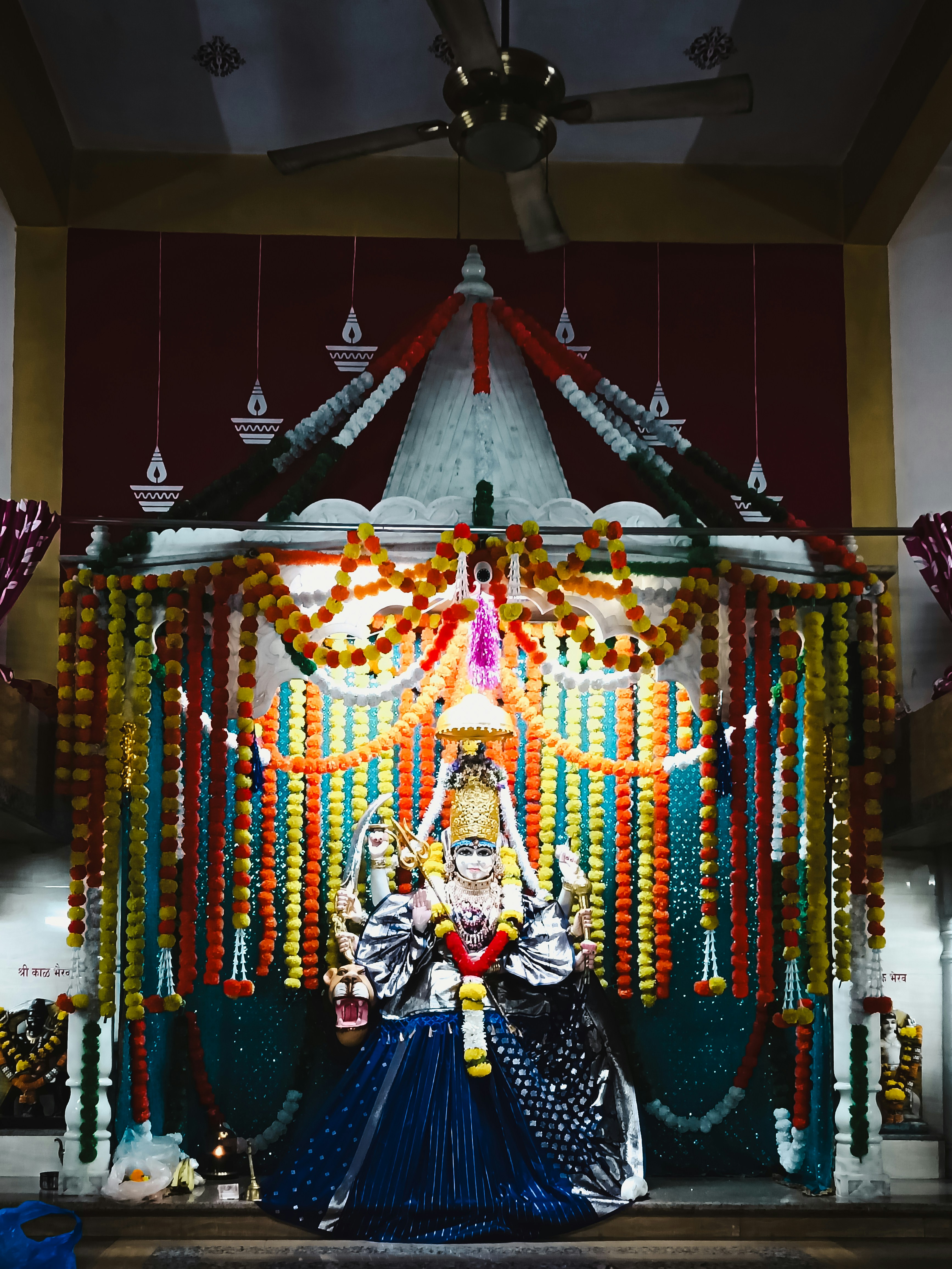 A statue of a woman in front of a stage