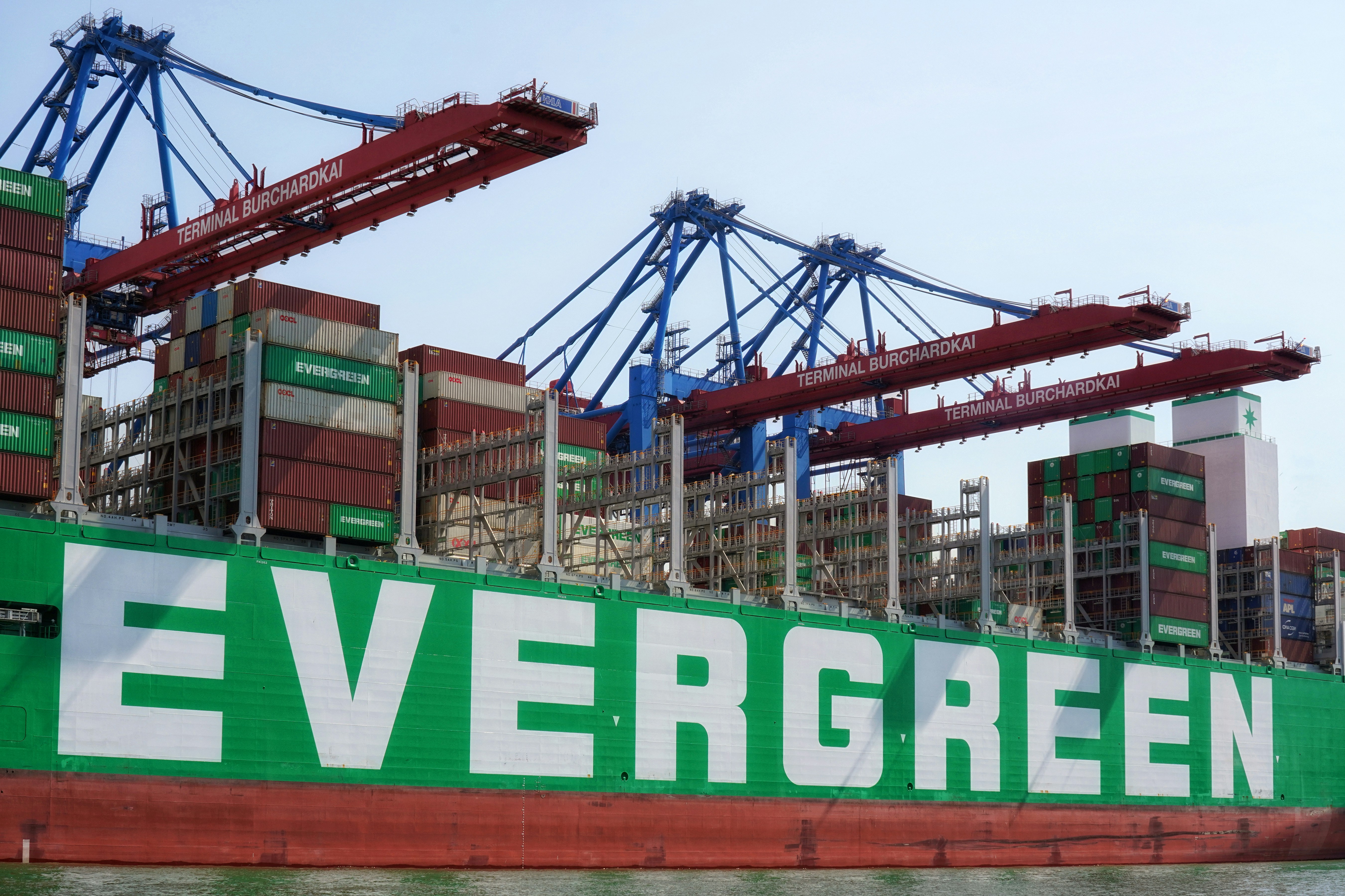A large container ship with a crane on top of it