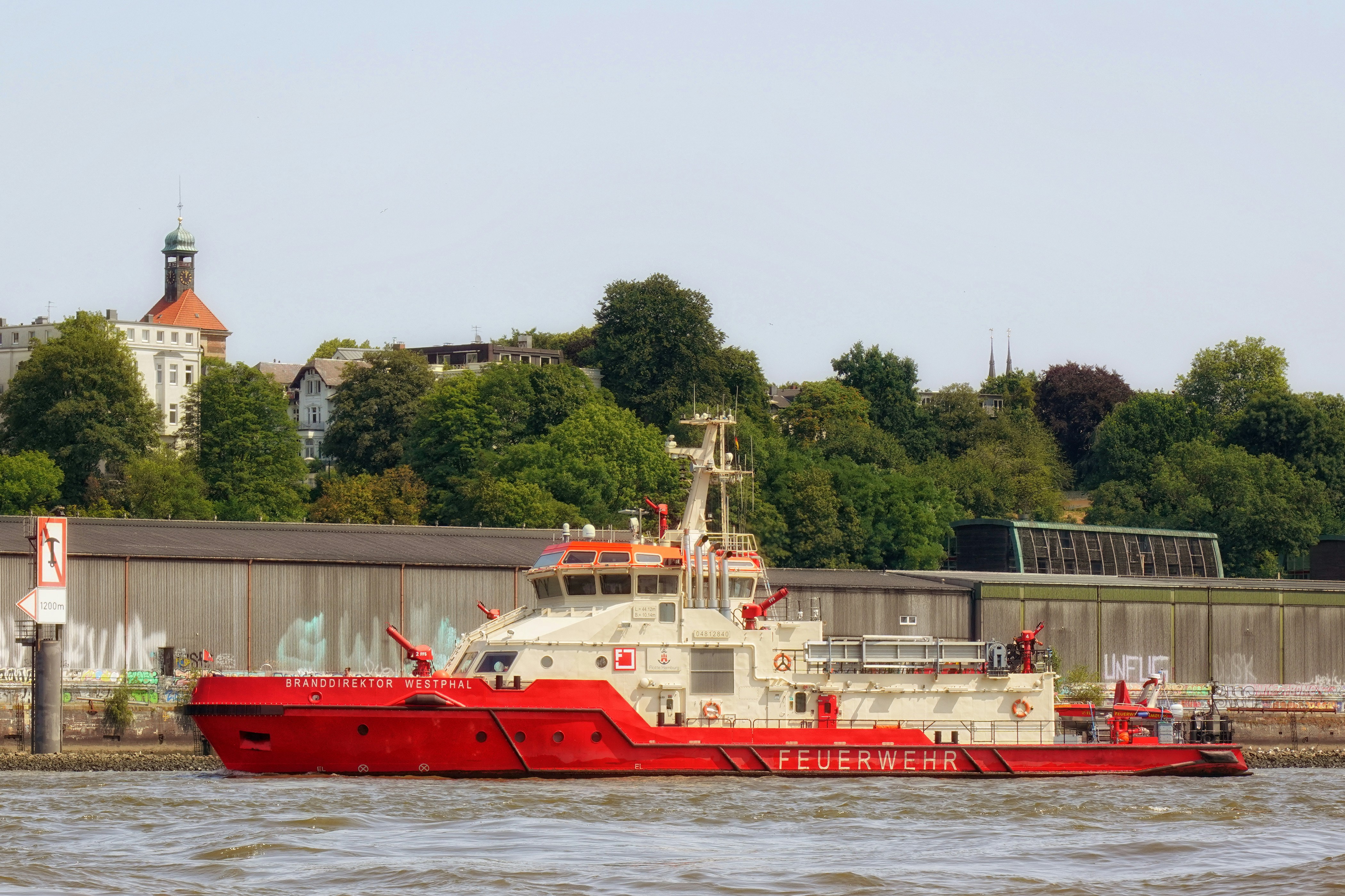 A red and white boat in a body of water