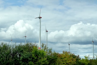 A row of wind turbines on a cloudy day