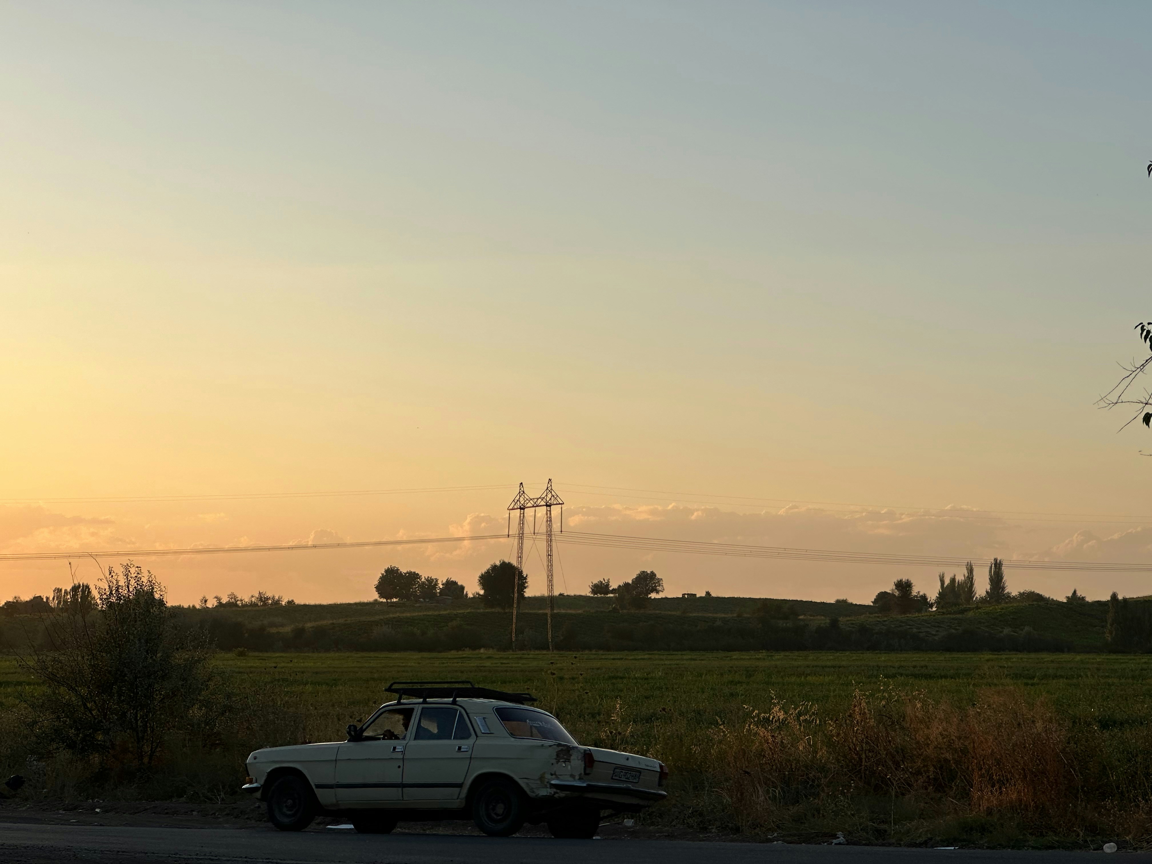 Electric car plugged in at a dealership charging station