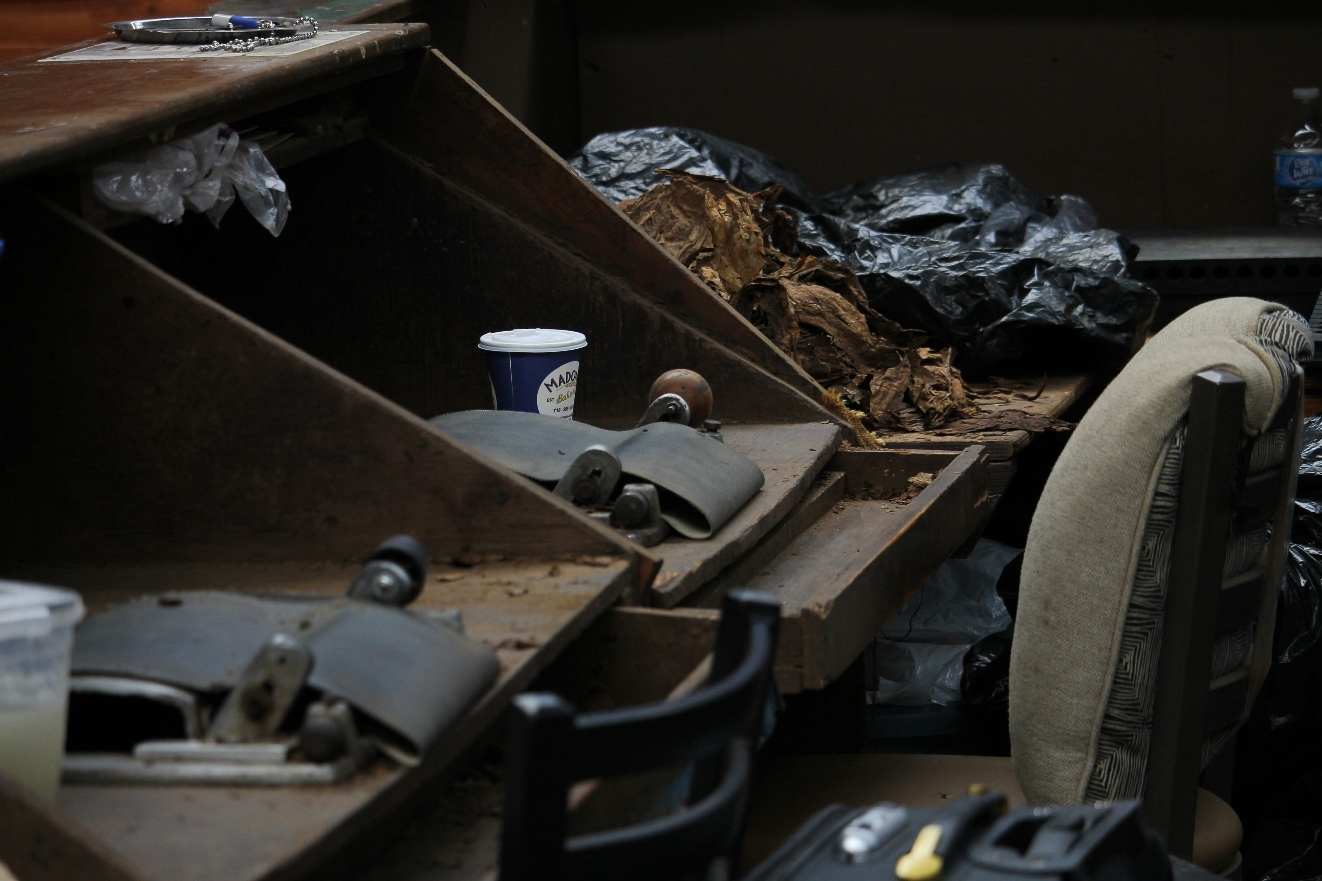 A pile of junk sitting on top of a wooden table