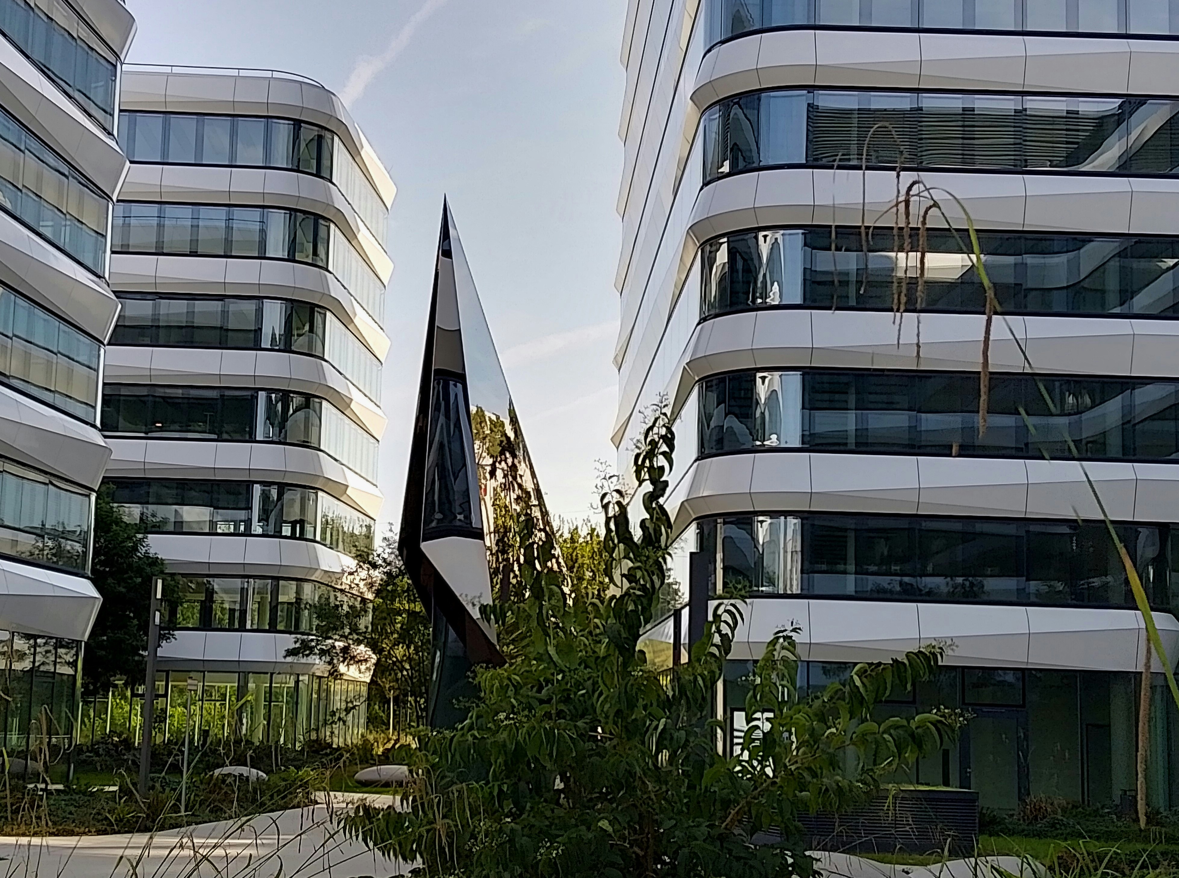 A couple of tall buildings sitting next to each other