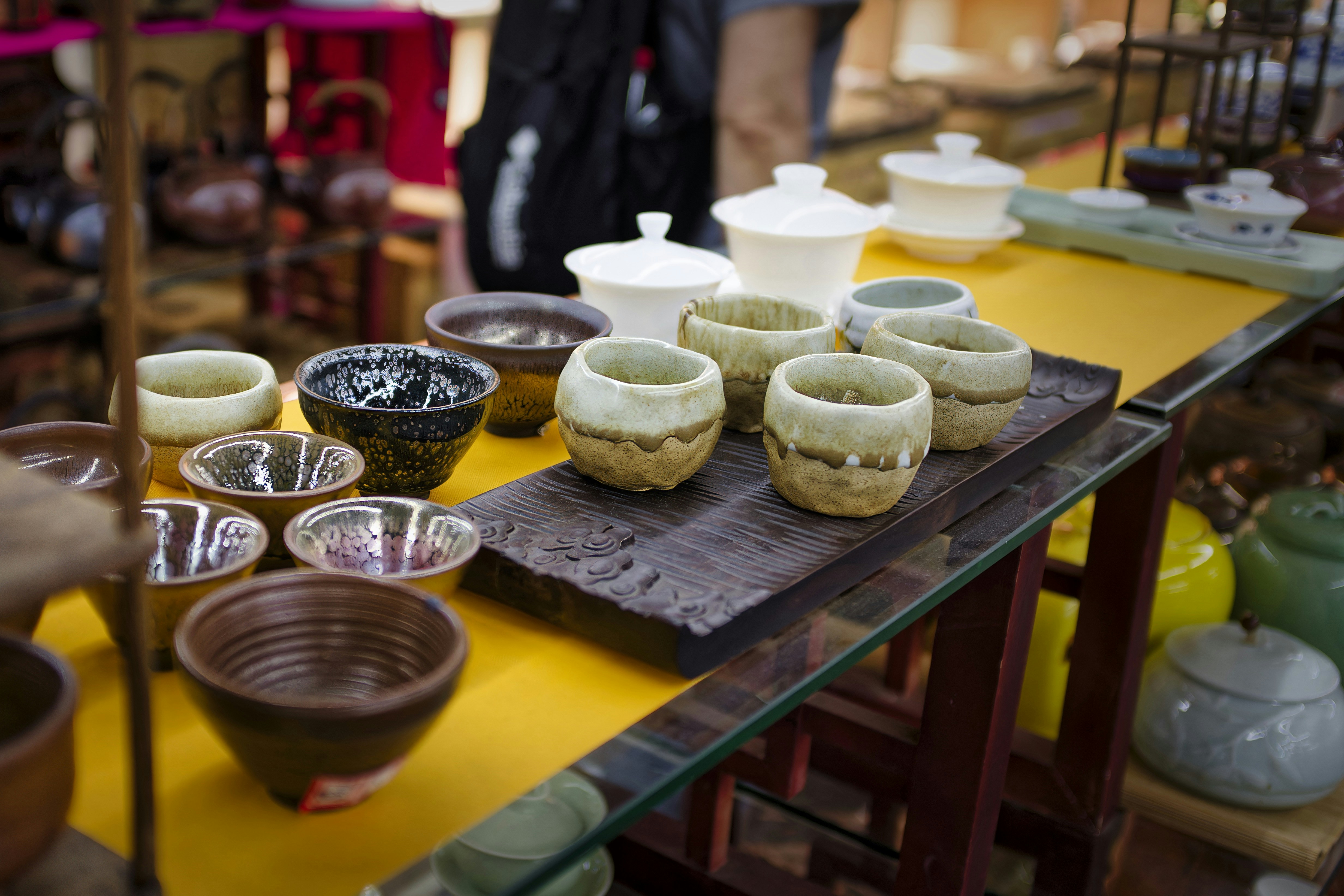 A table topped with lots of bowls and bowls
