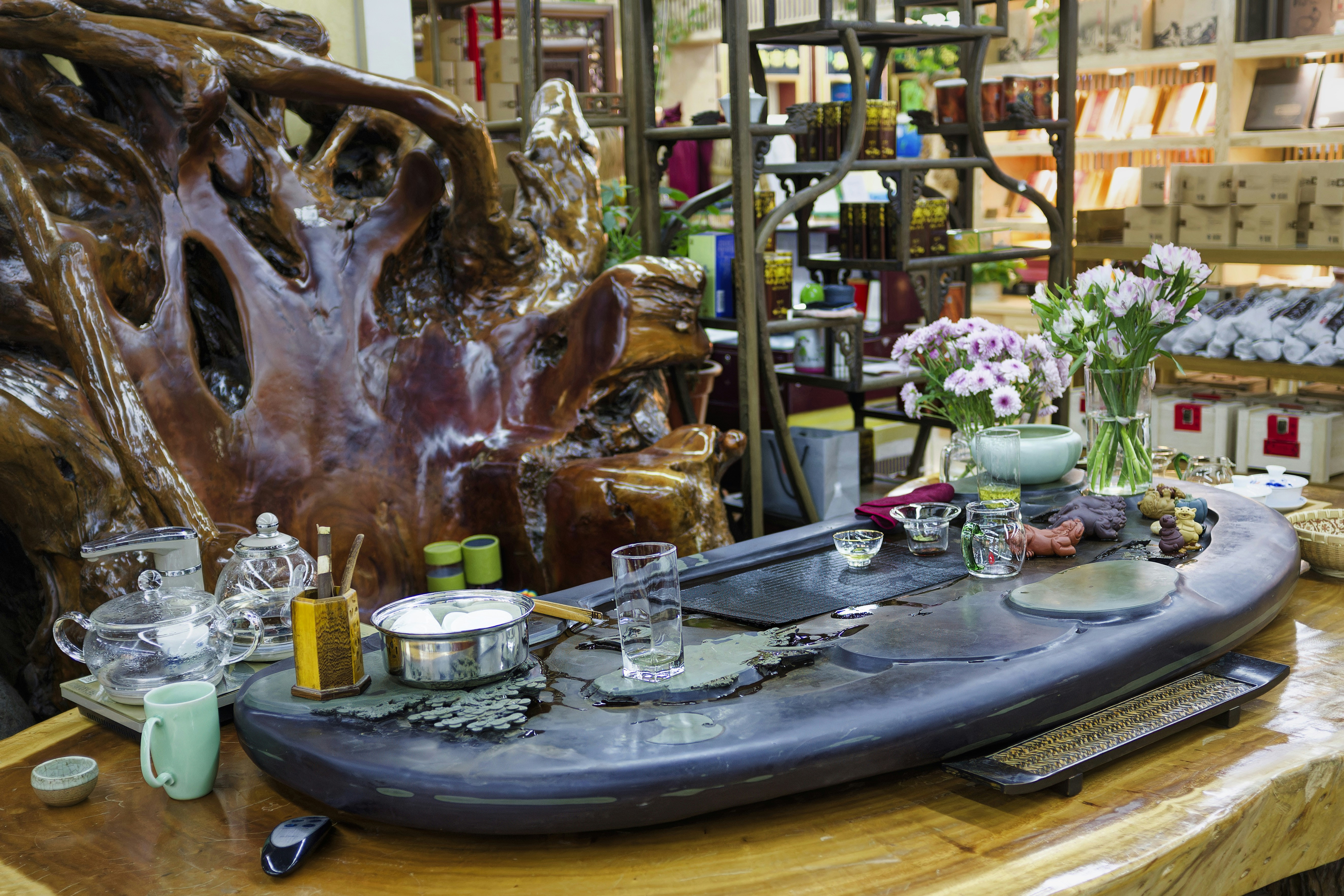 A serene tea setup in a cozy tea house filled with natural decor
