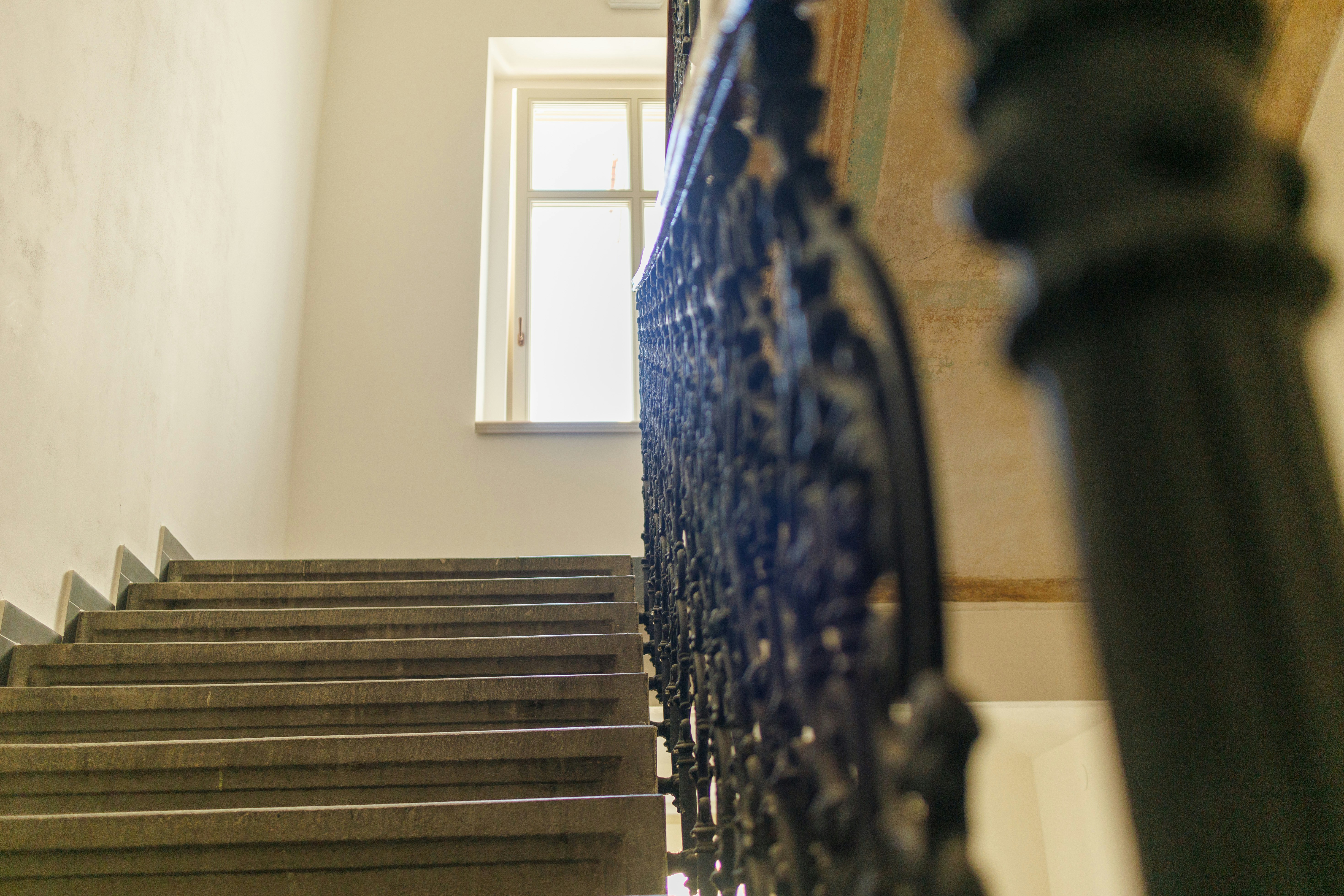 A stair case with a window above it
