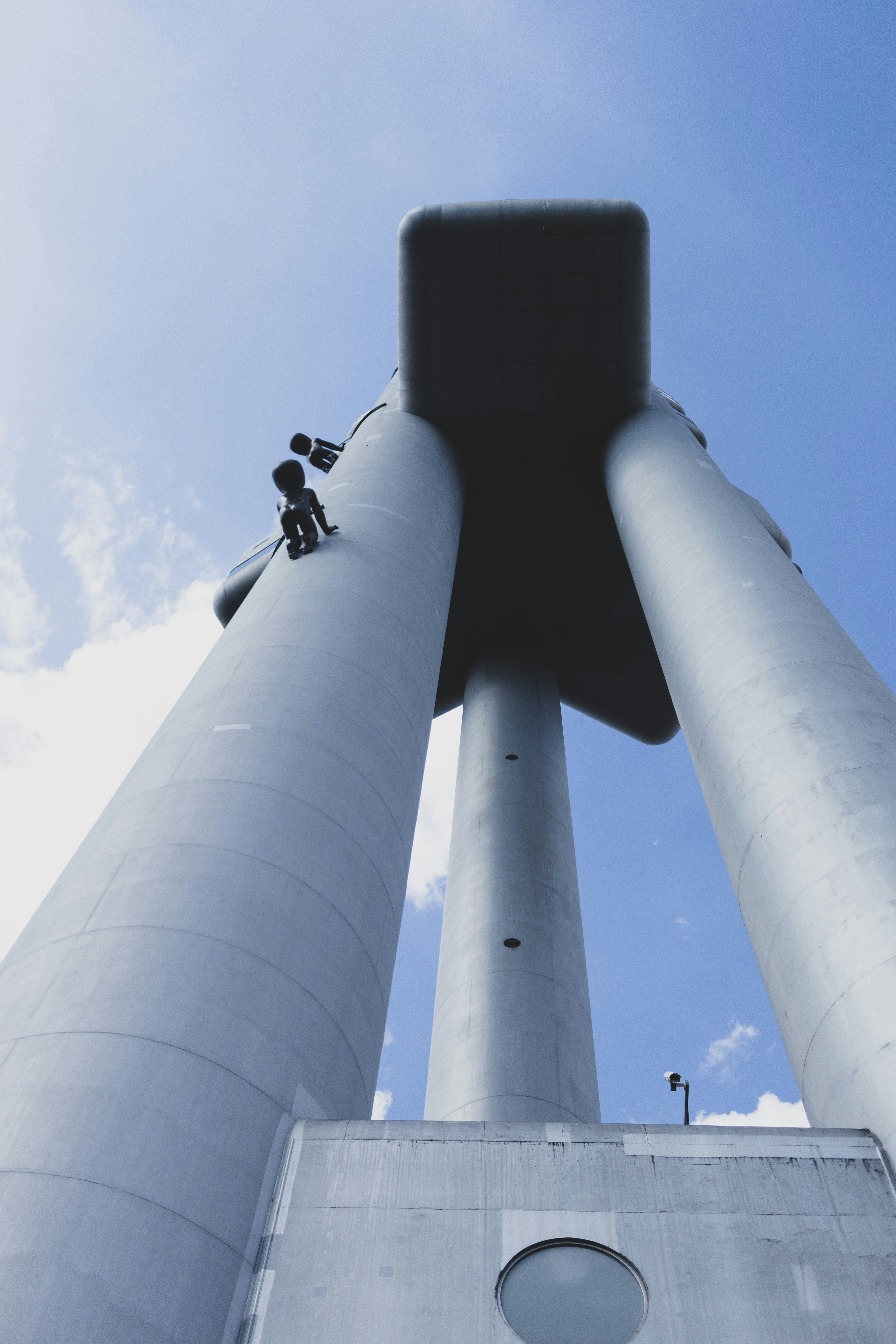 A man standing on the top of a tall tower