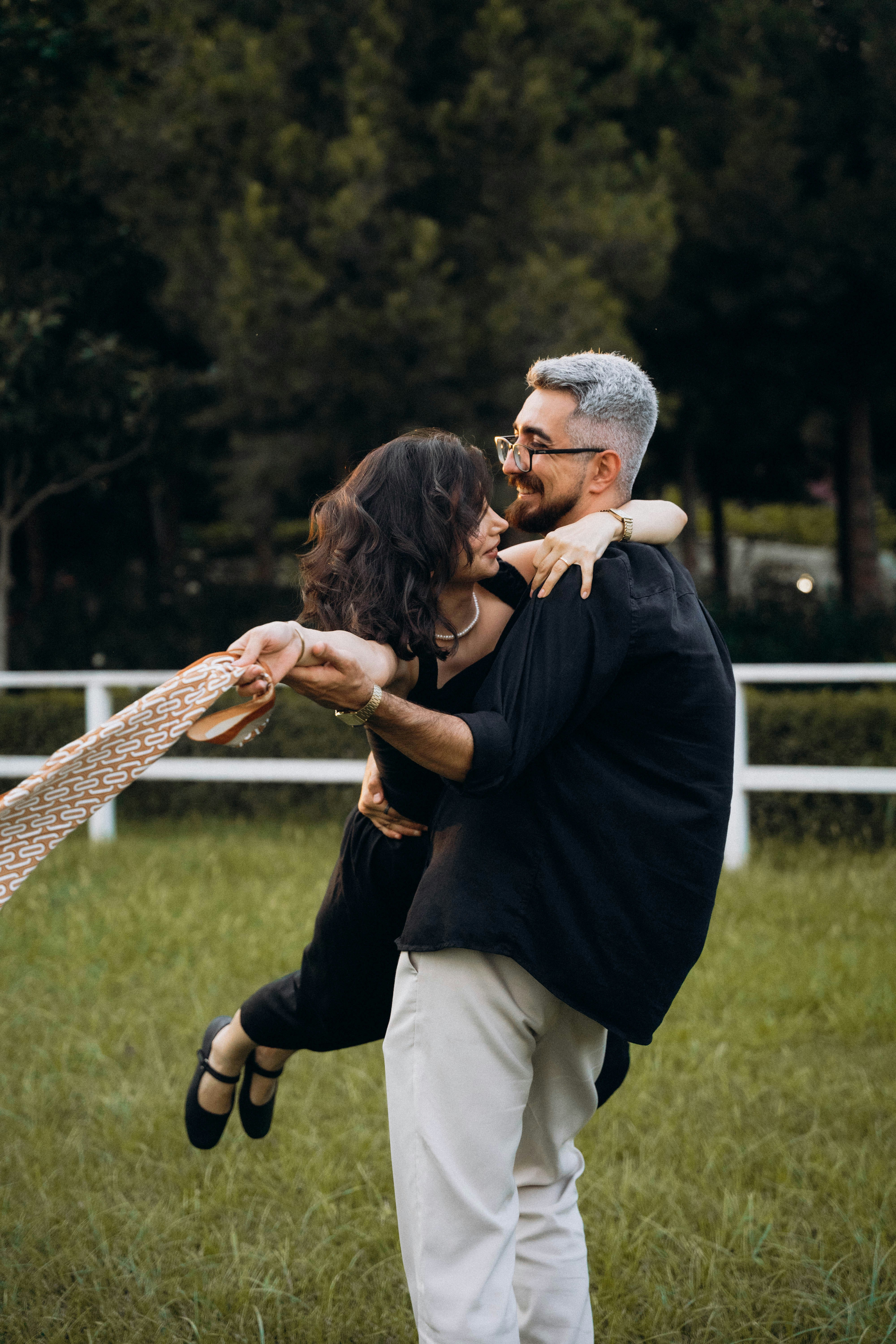 A man and a woman hugging in a field