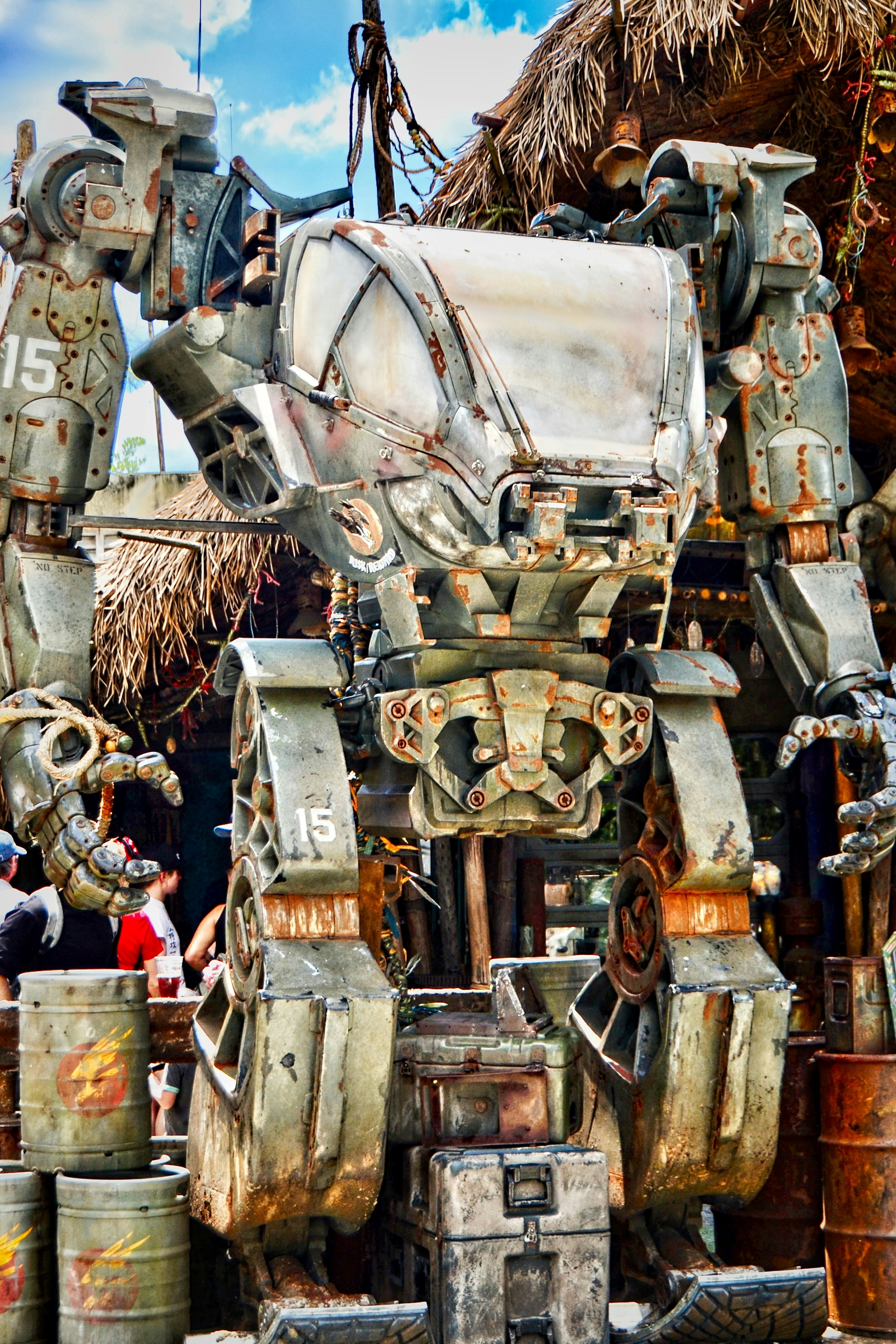 A large robot made out of metal barrels