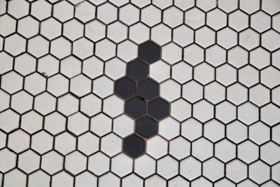 A black and white tiled floor with a hexagonal pattern