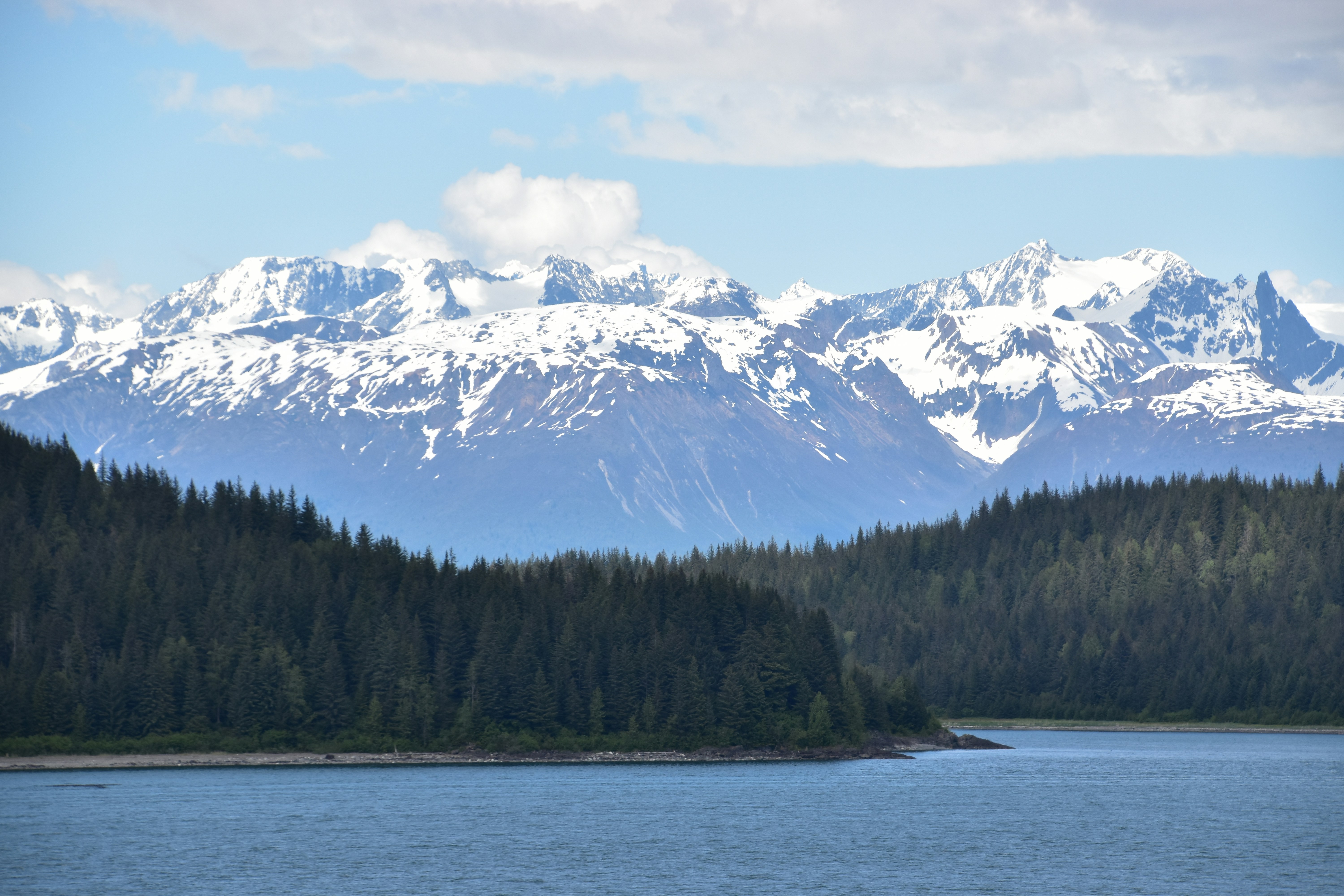A large body of water with mountains in the background