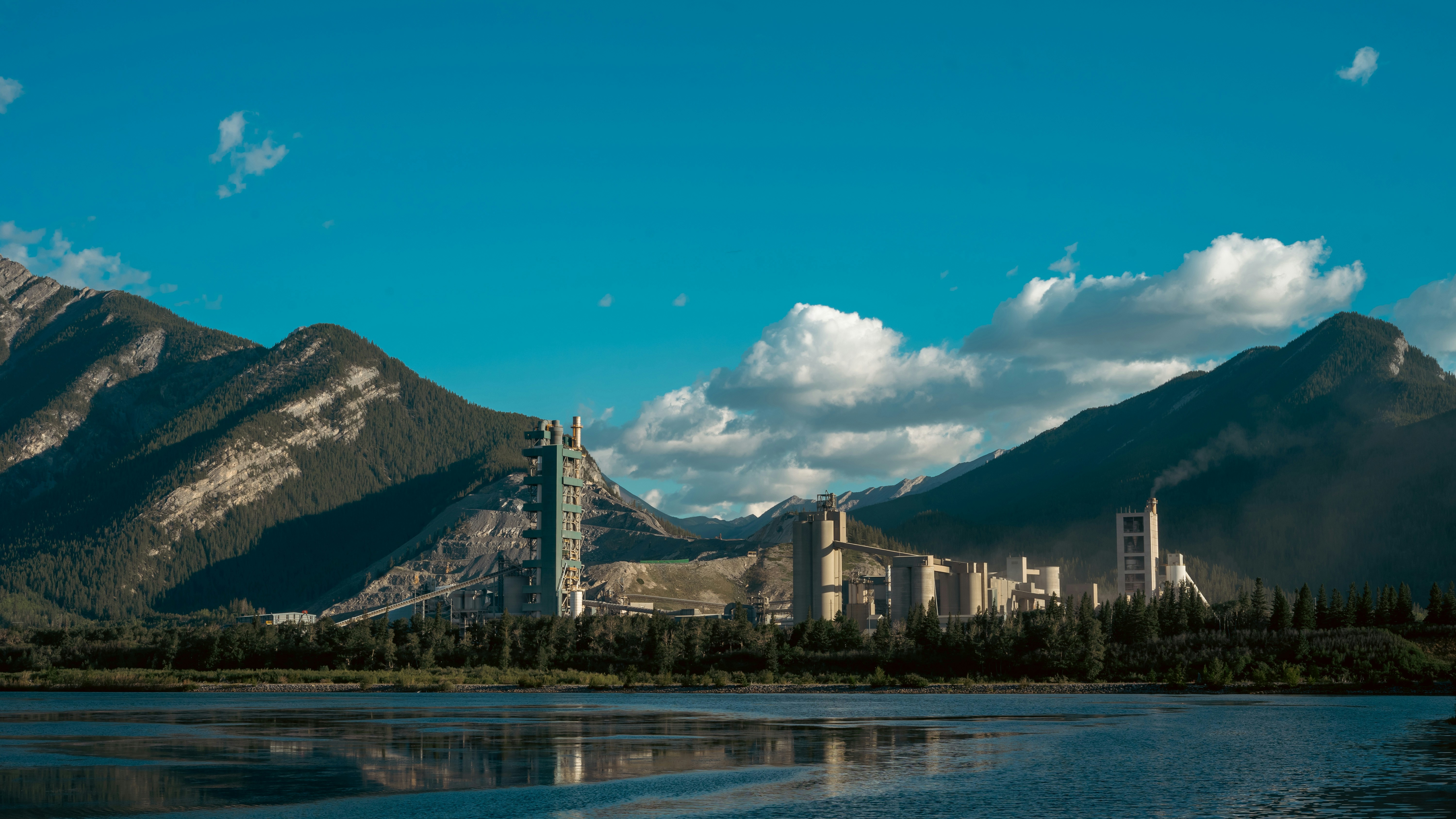 A body of water with mountains in the background