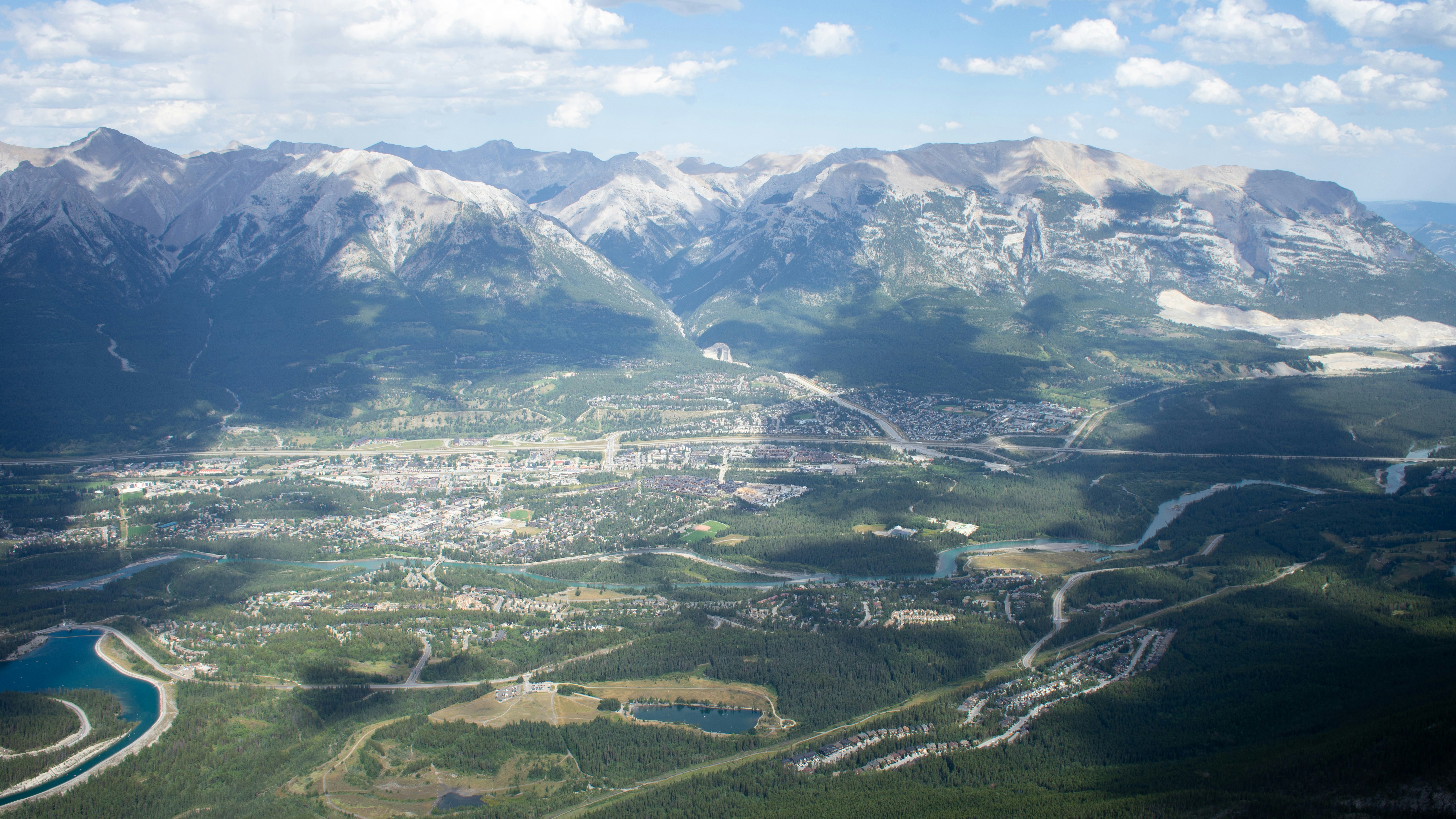 An aerial view of a city and mountains