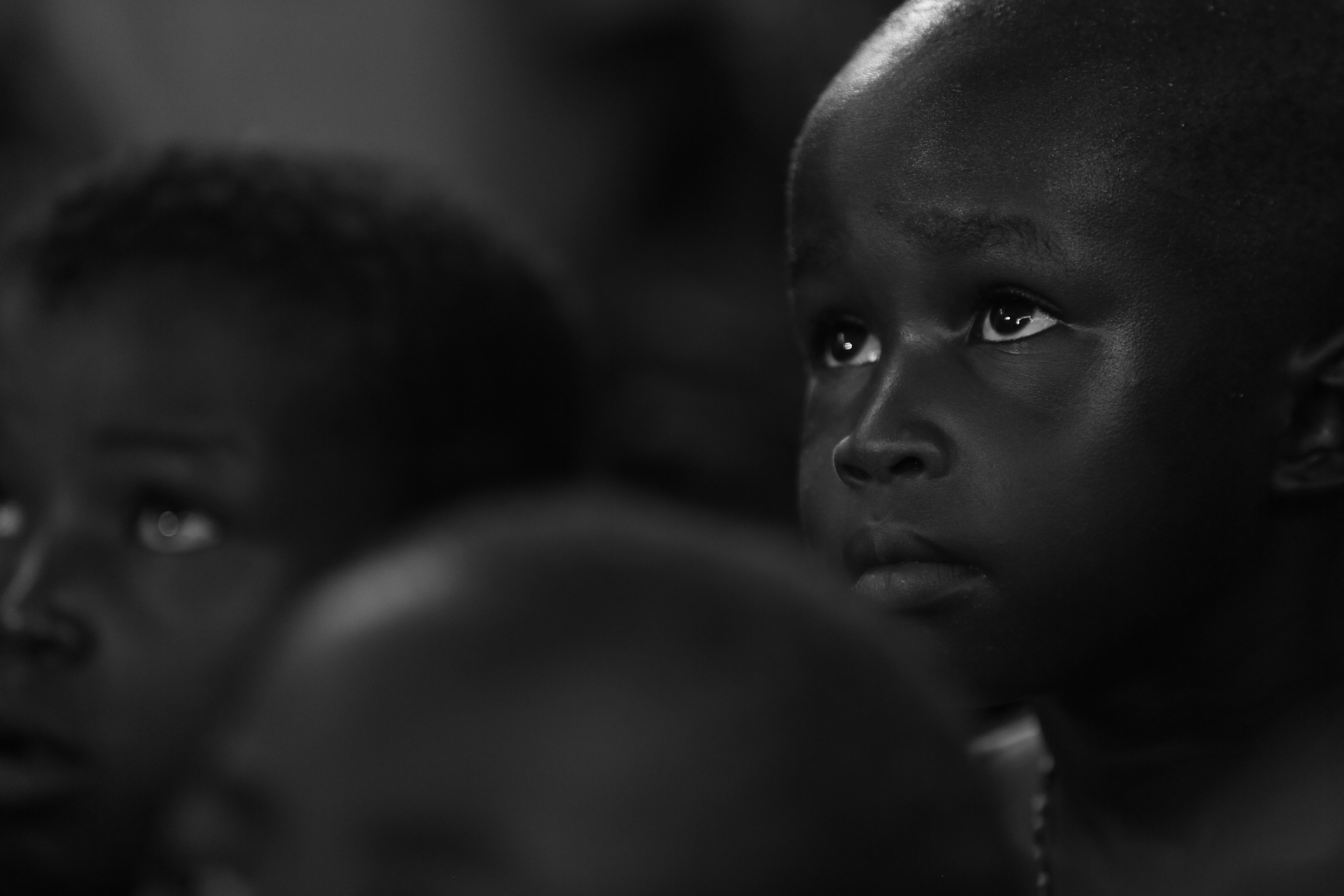A group of young children sitting next to each other
