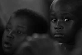 A black and white photo of two children