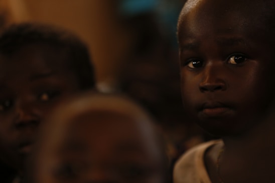 A group of young children sitting next to each other